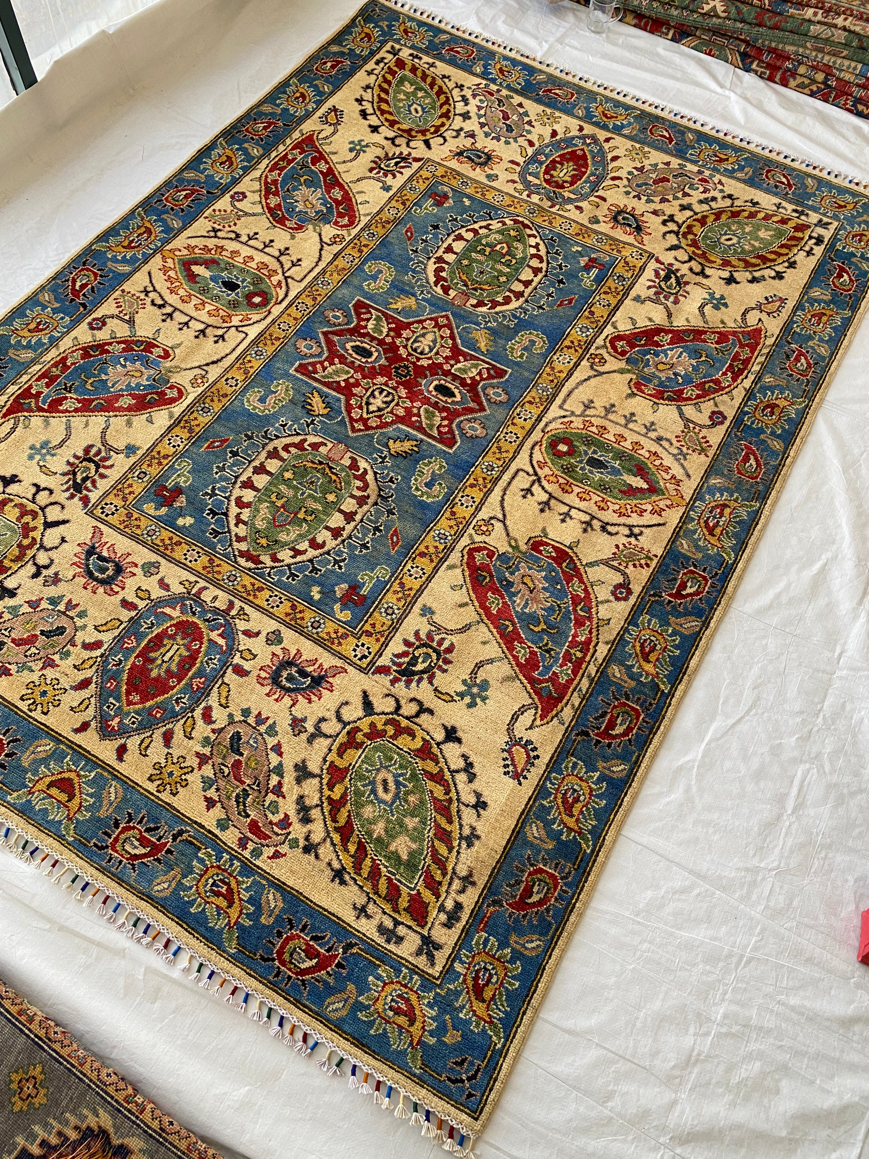 Afghani Rug 6x9 size range floral Blue Cream laid flat