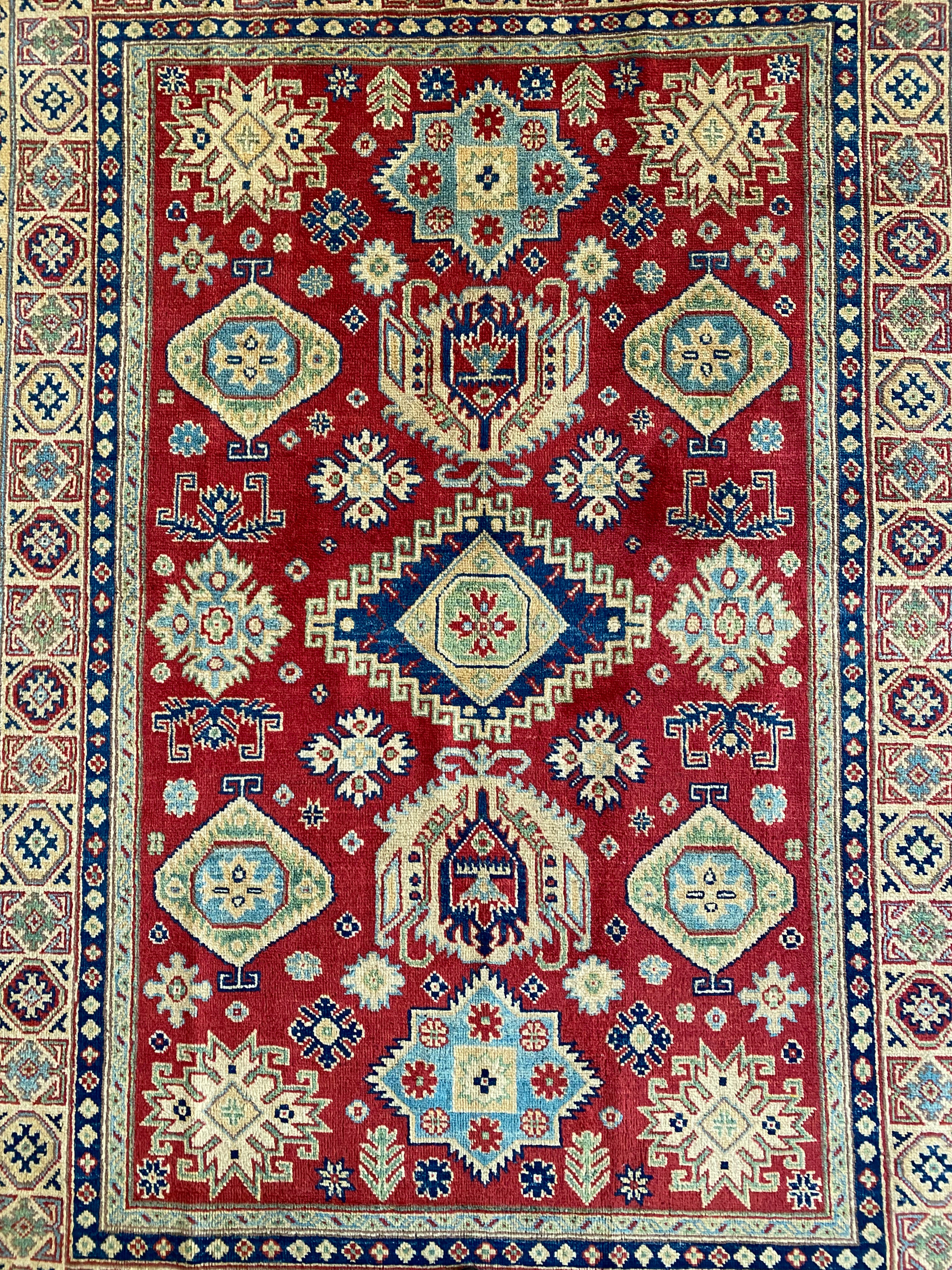 Afghani Rug 5x8 size range tribal Red Cream laid flat