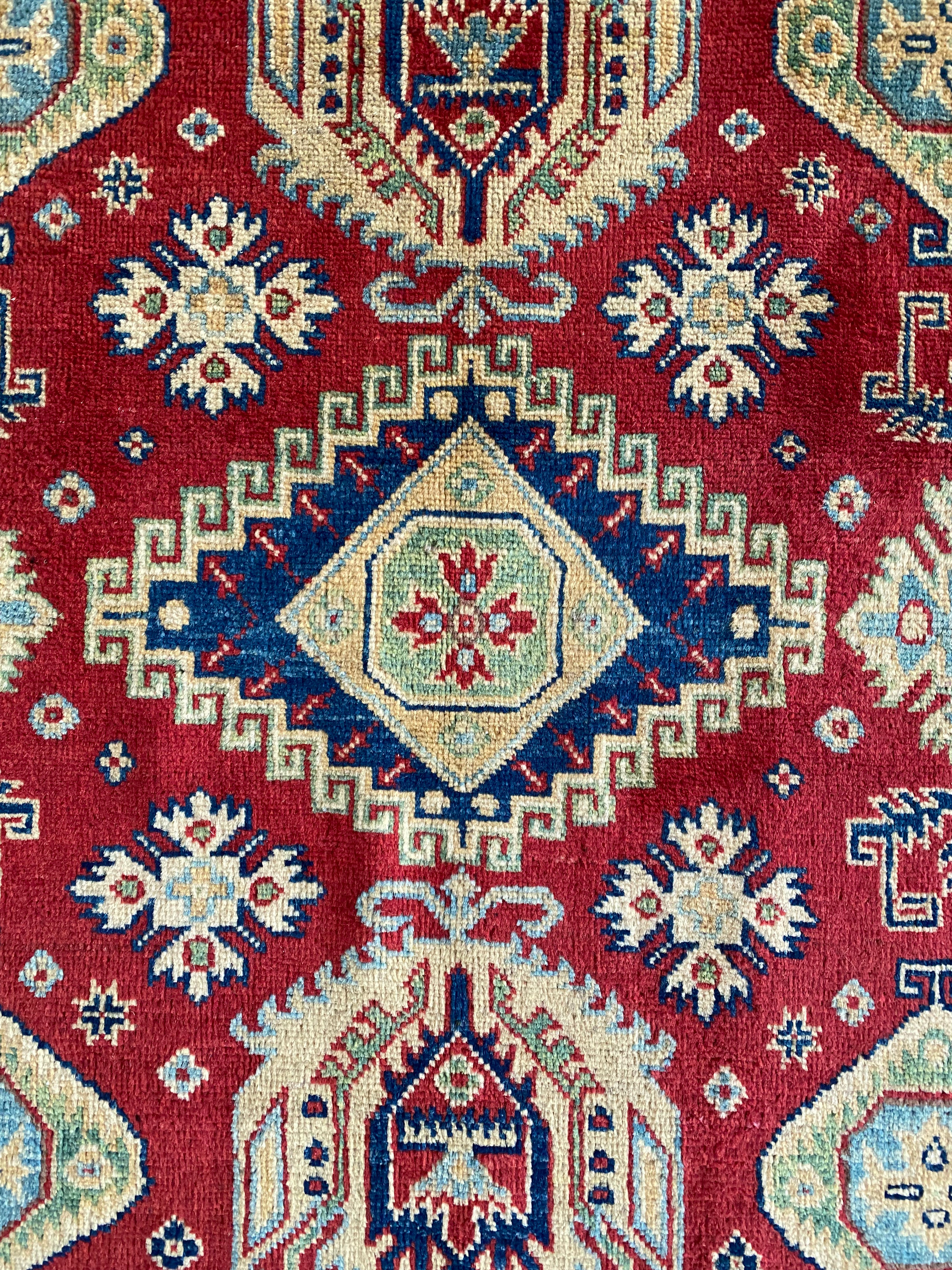 Afghani Rug 5x8 size range tribal Red Cream laid flat