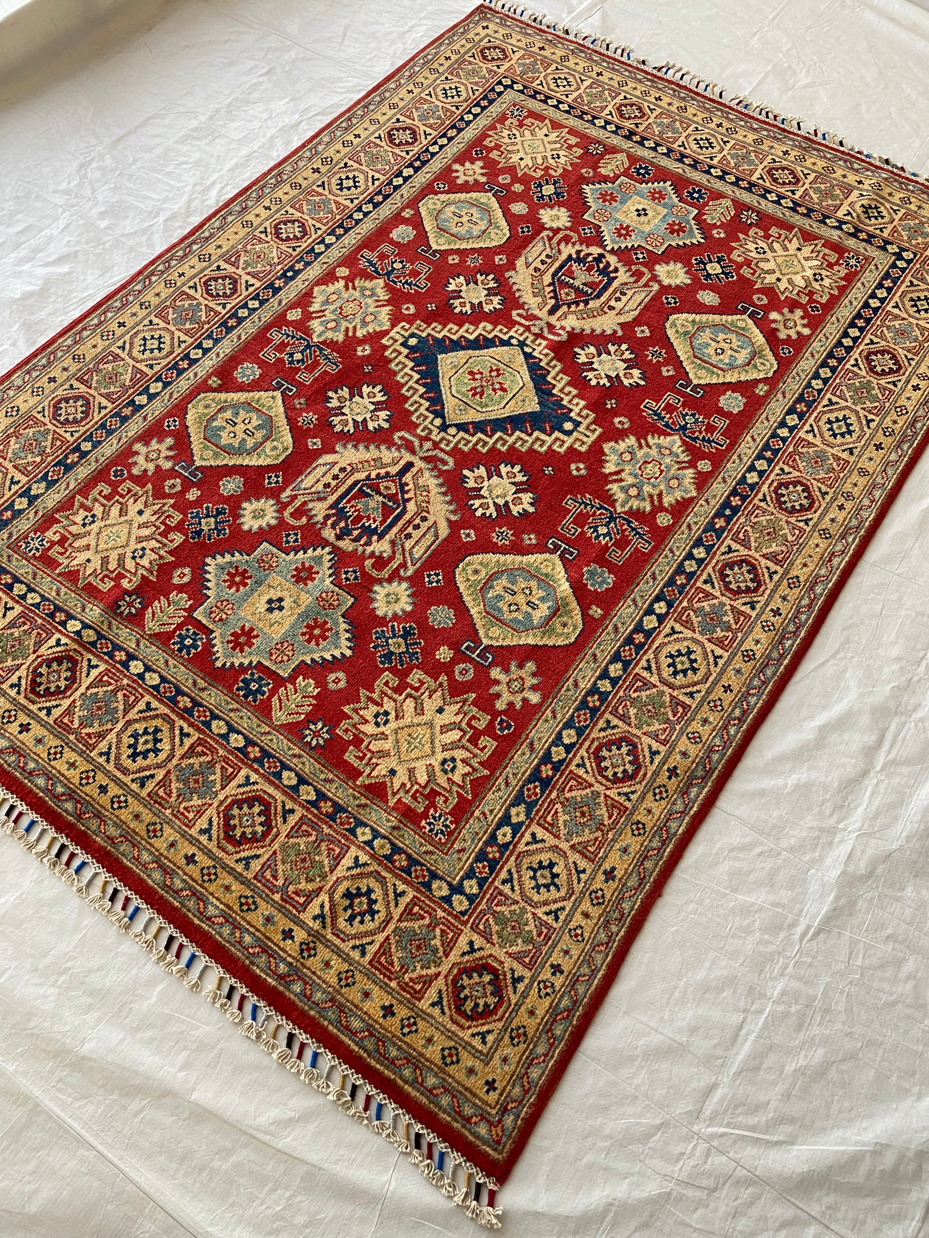 Afghani Rug 5x8 size range tribal Red Cream laid flat