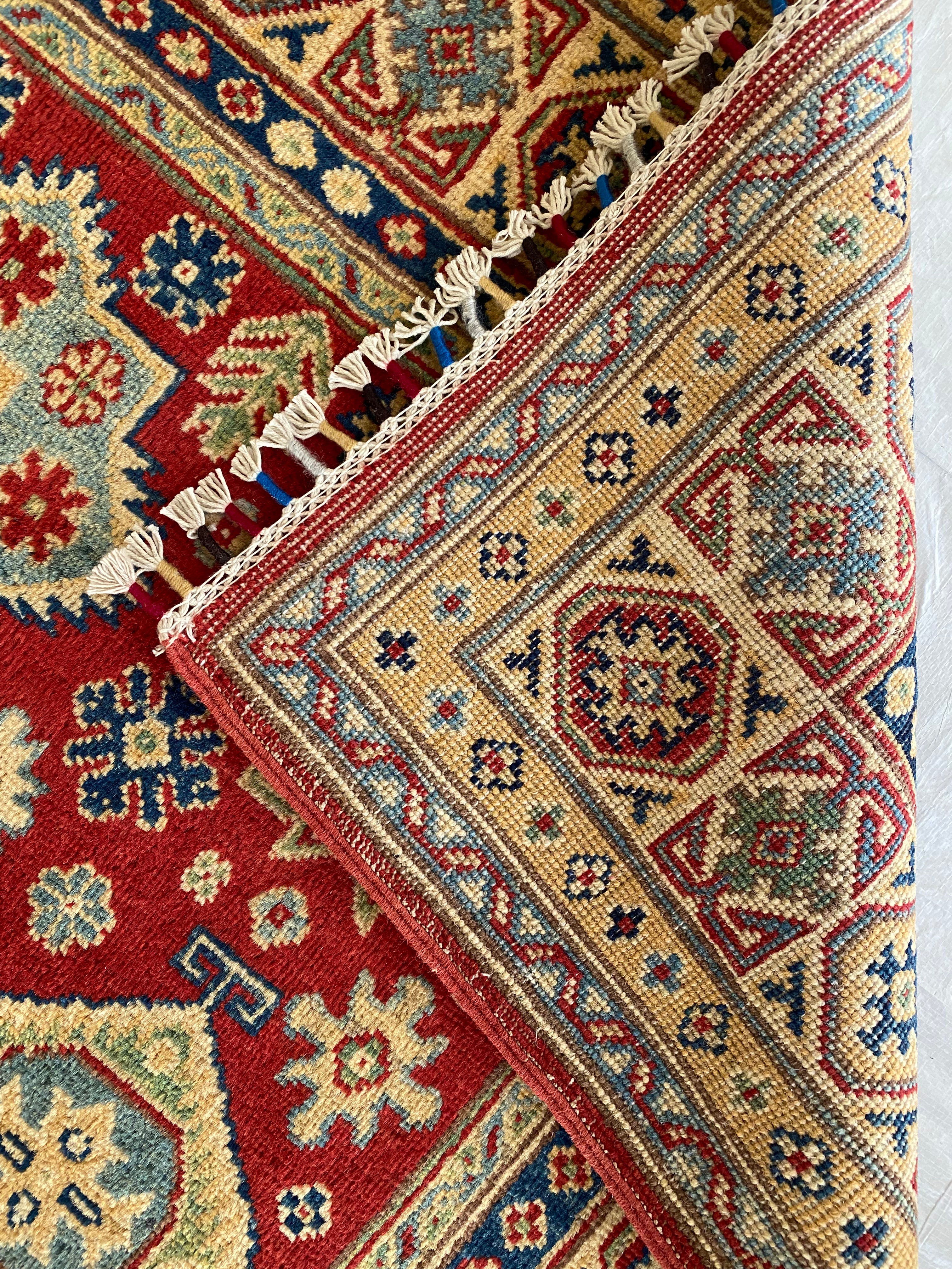 Afghani Rug 5x8 size range tribal Red Cream laid flat