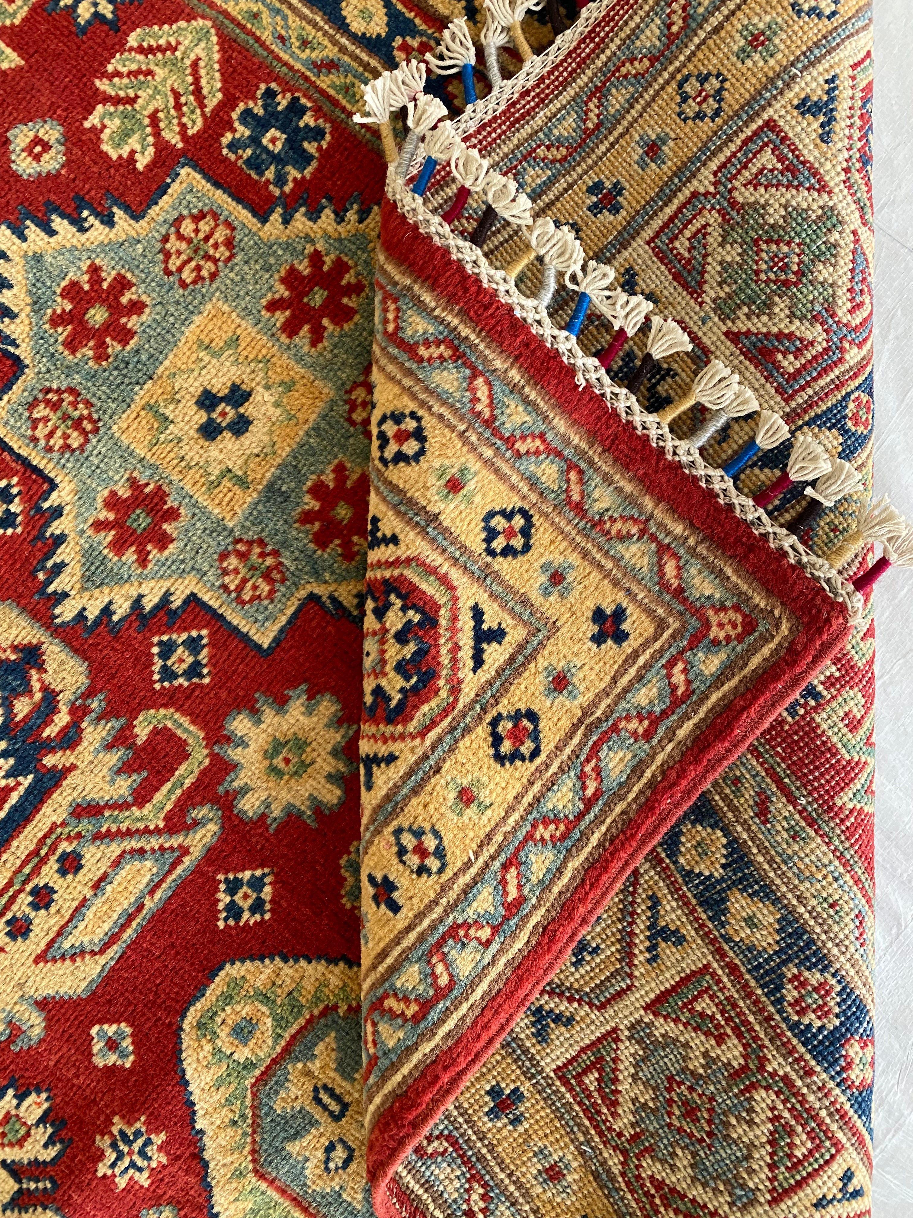 Afghani Rug 5x8 size range tribal Red Cream laid flat