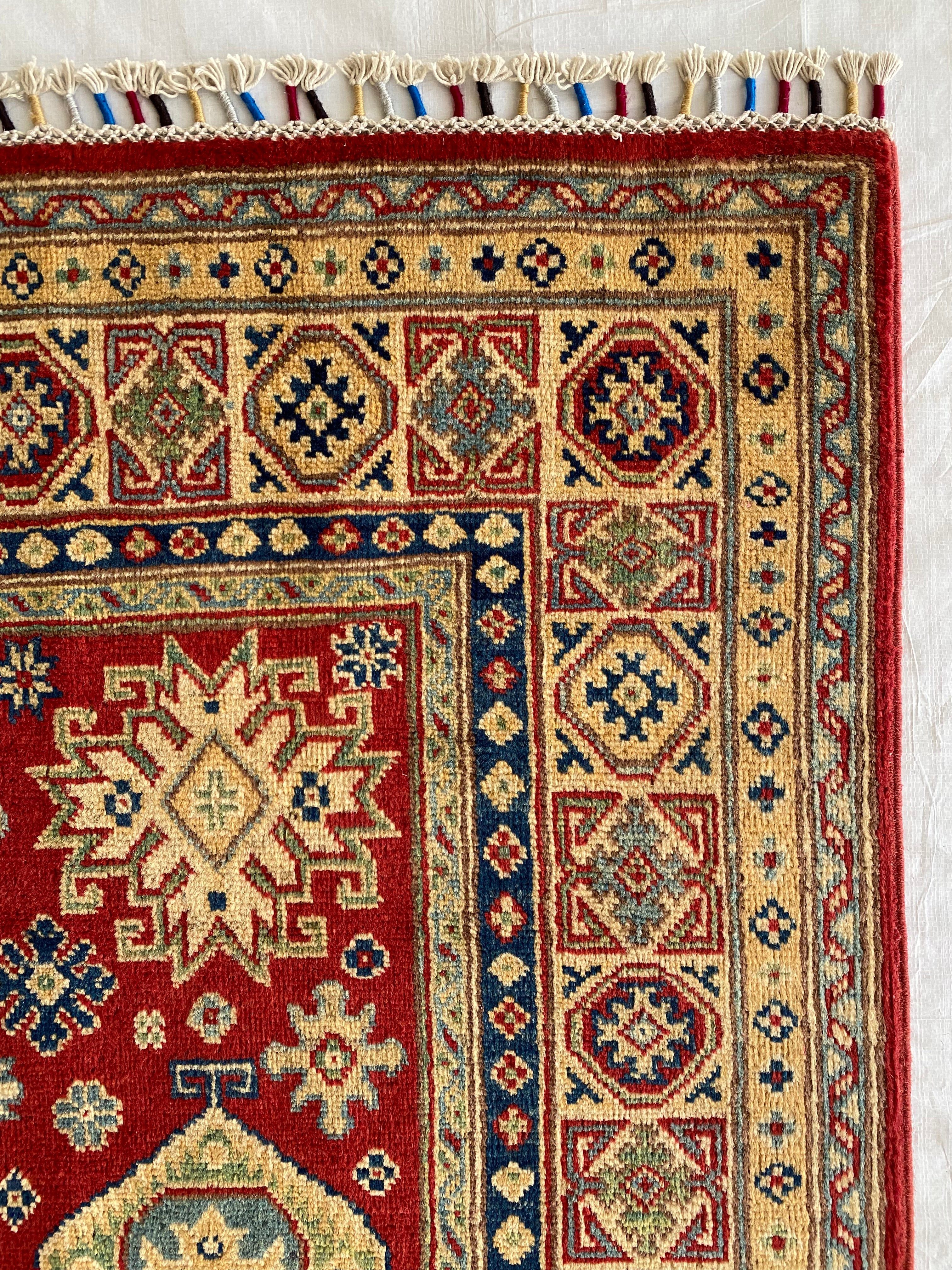 Afghani Rug 5x8 size range tribal Red Cream laid flat