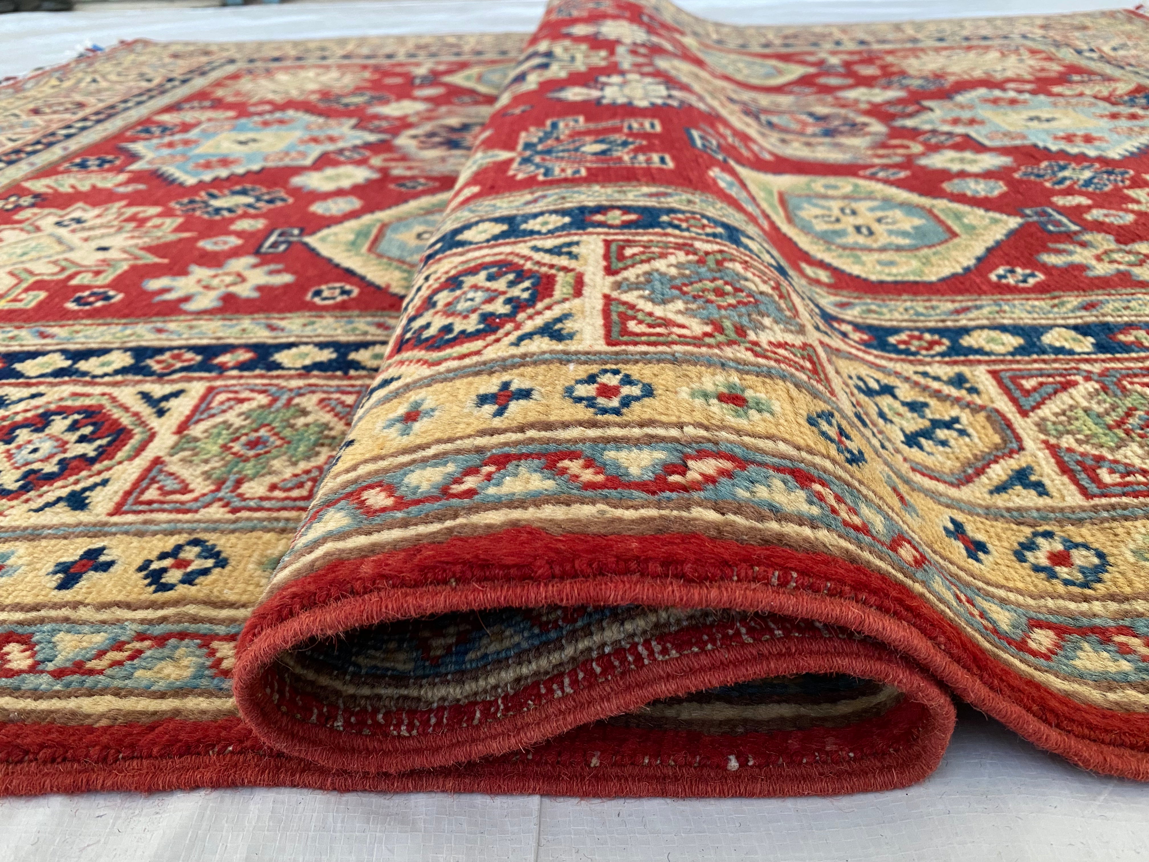Afghani Rug 5x8 size range tribal Red Cream laid flat