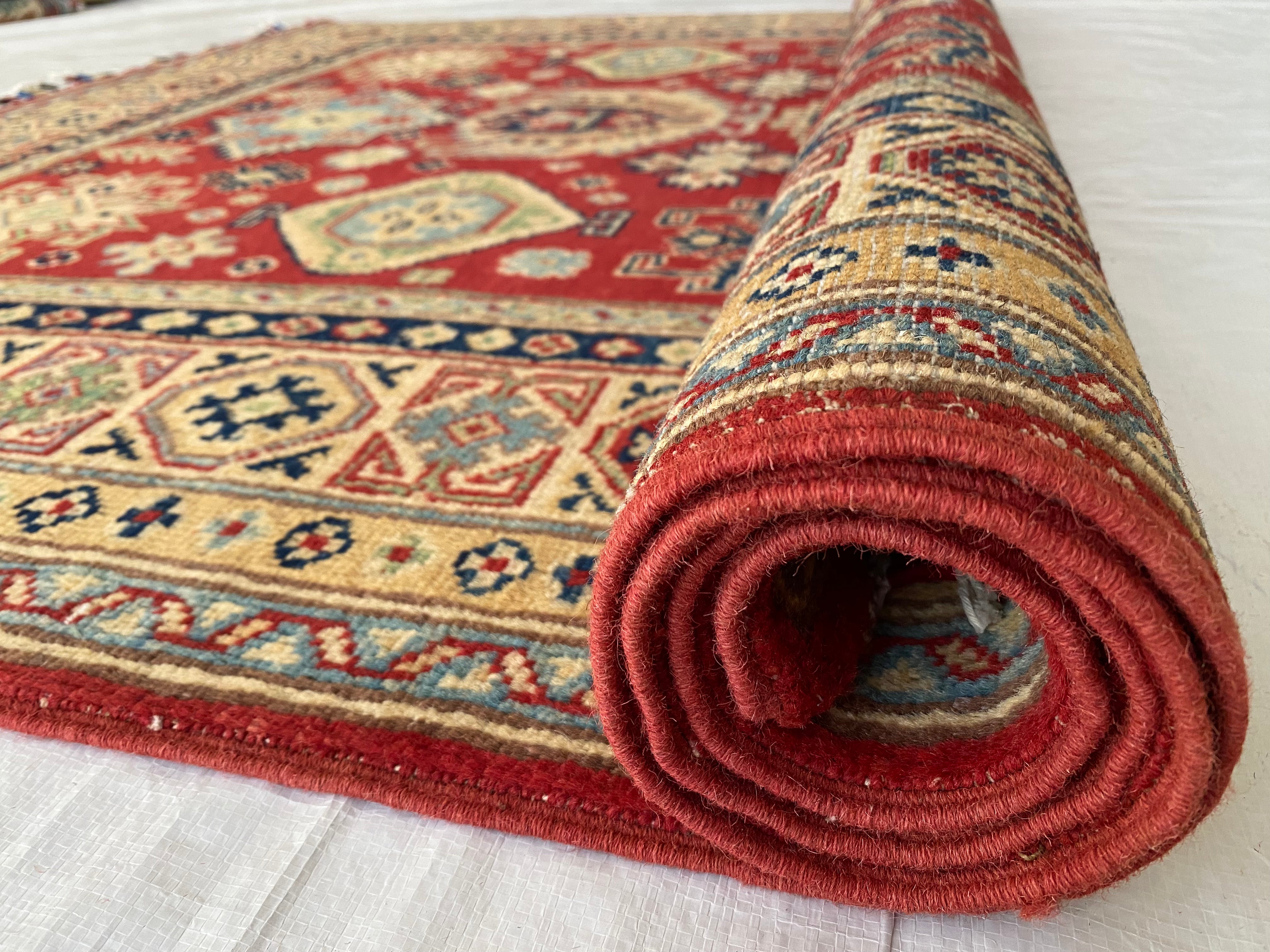 Afghani Rug 5x8 size range tribal Red Cream laid flat