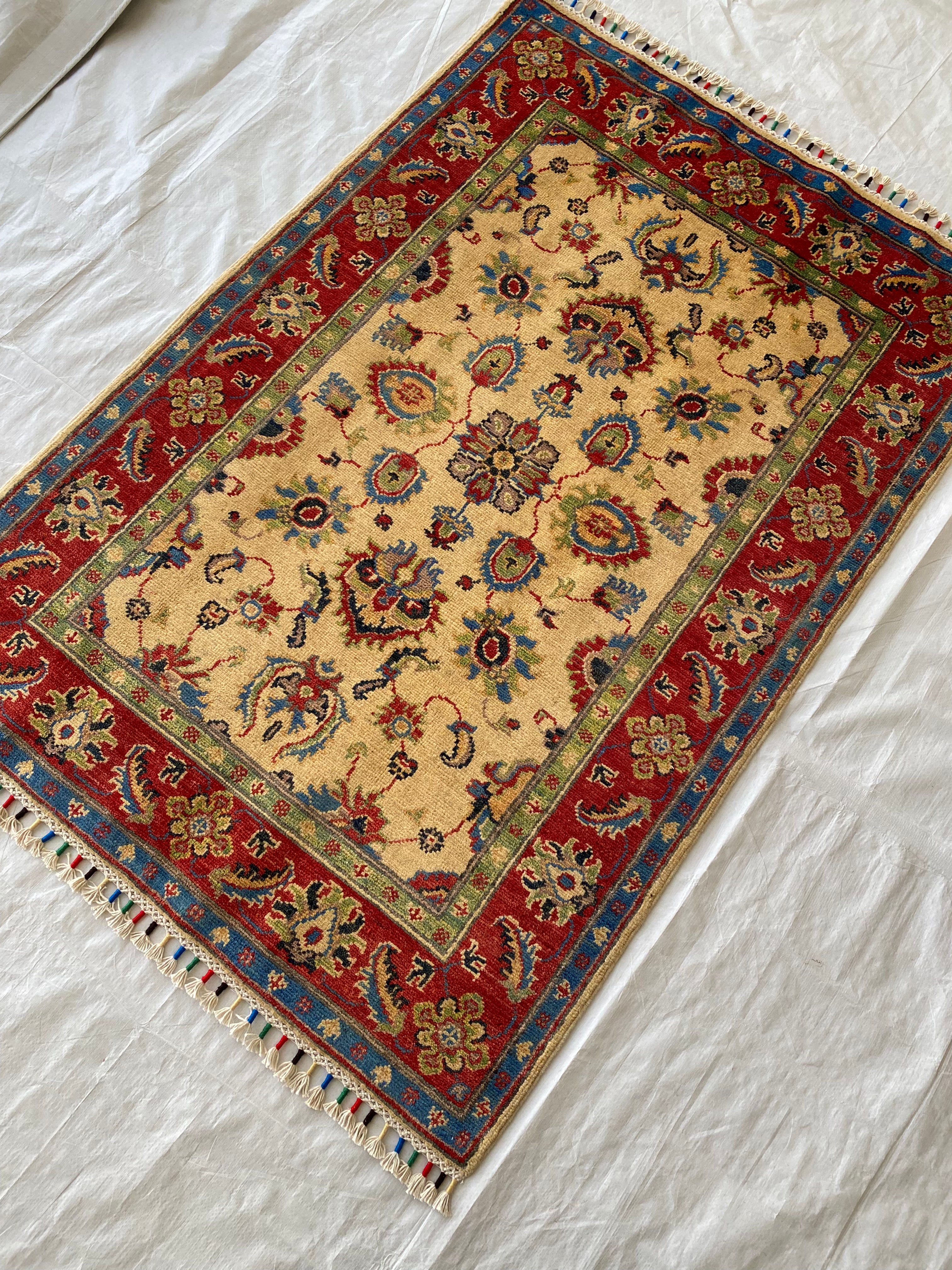 Afghani Rug 4x6 size range floral Red Cream laid flat