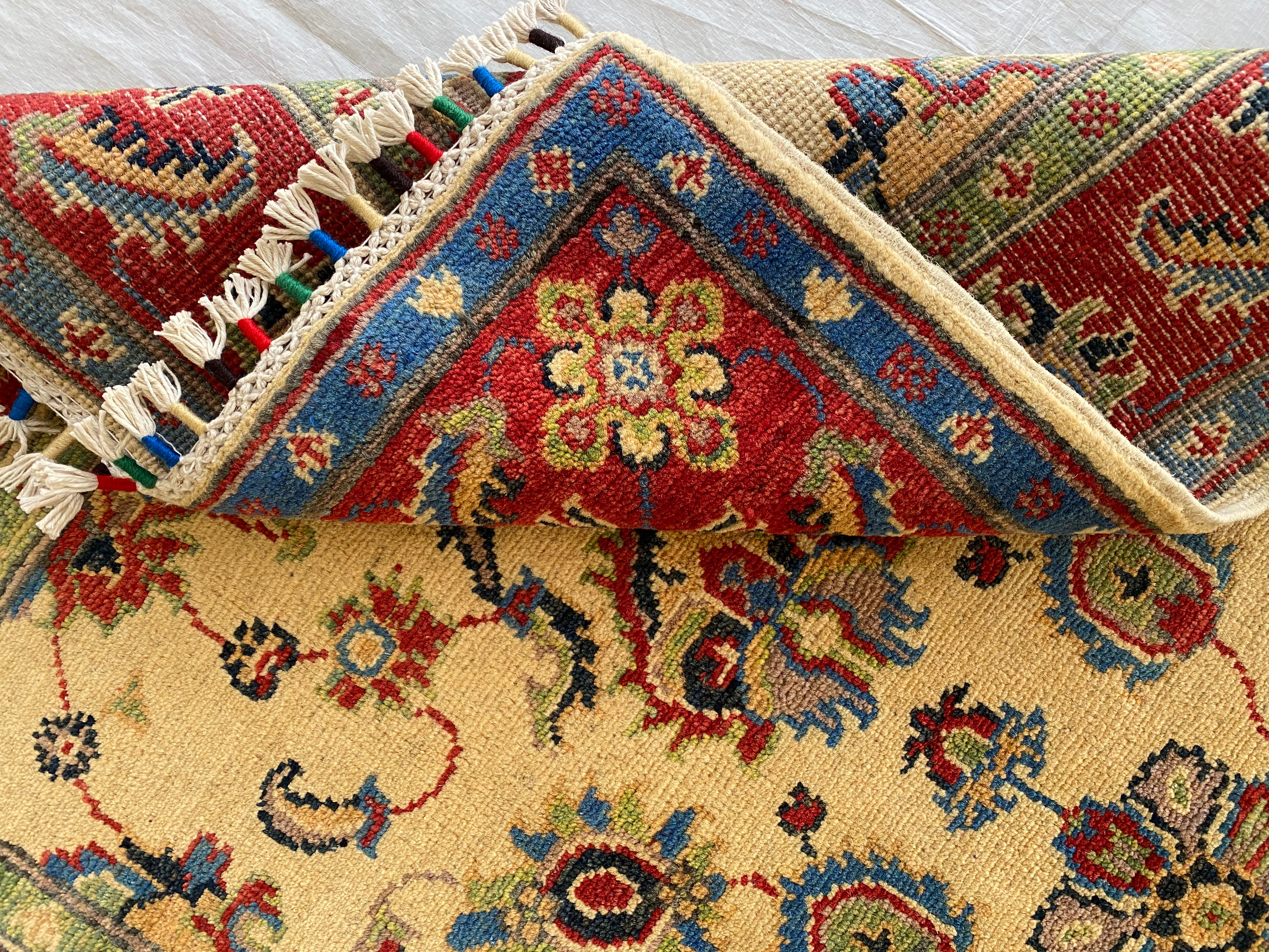 Afghani Rug 4x6 size range floral Red Cream laid flat