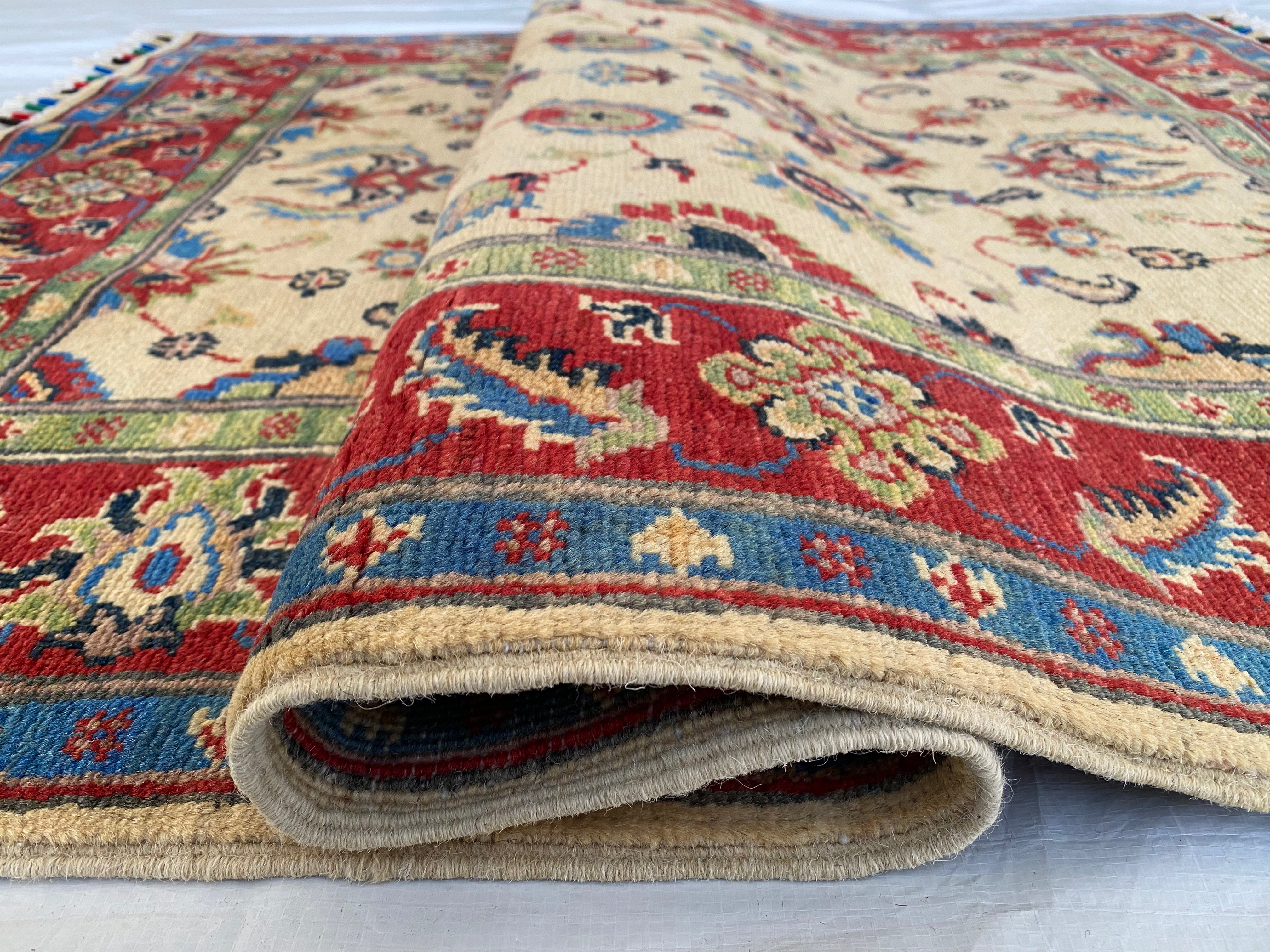 Afghani Rug 4x6 size range floral Red Cream laid flat