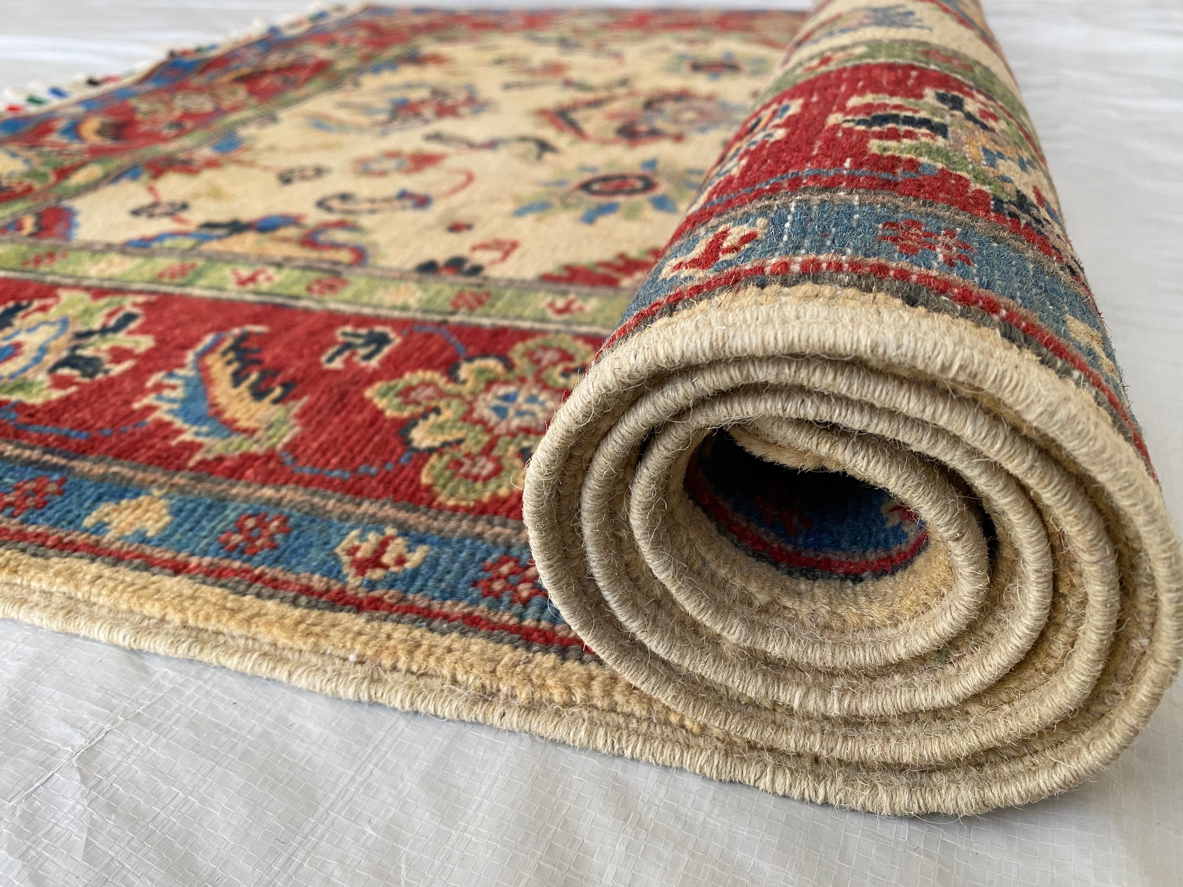 Afghani Rug 4x6 size range floral Red Cream laid flat