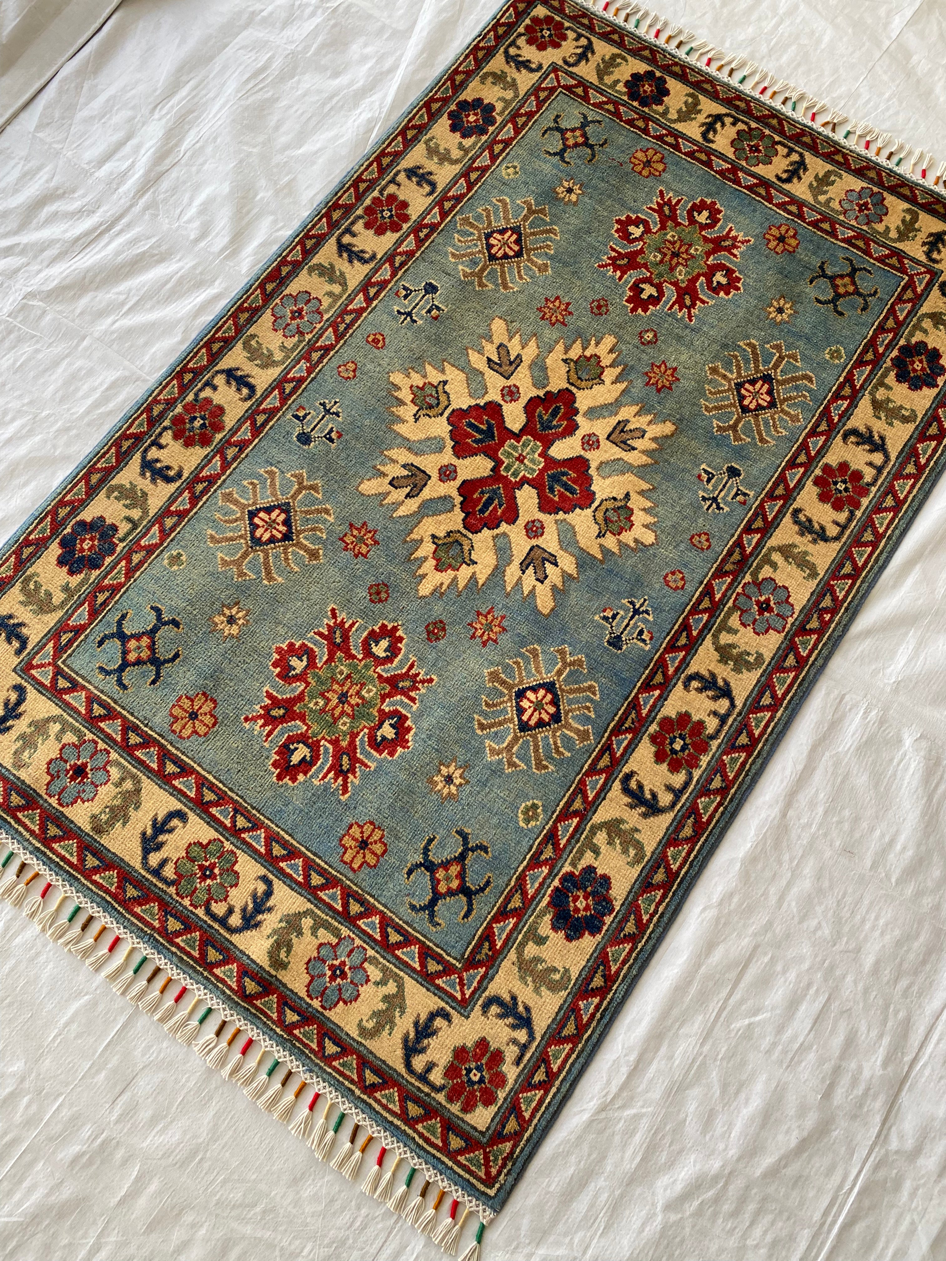 Afghani Rug 4x6 size range tribal Blue Cream laid flat