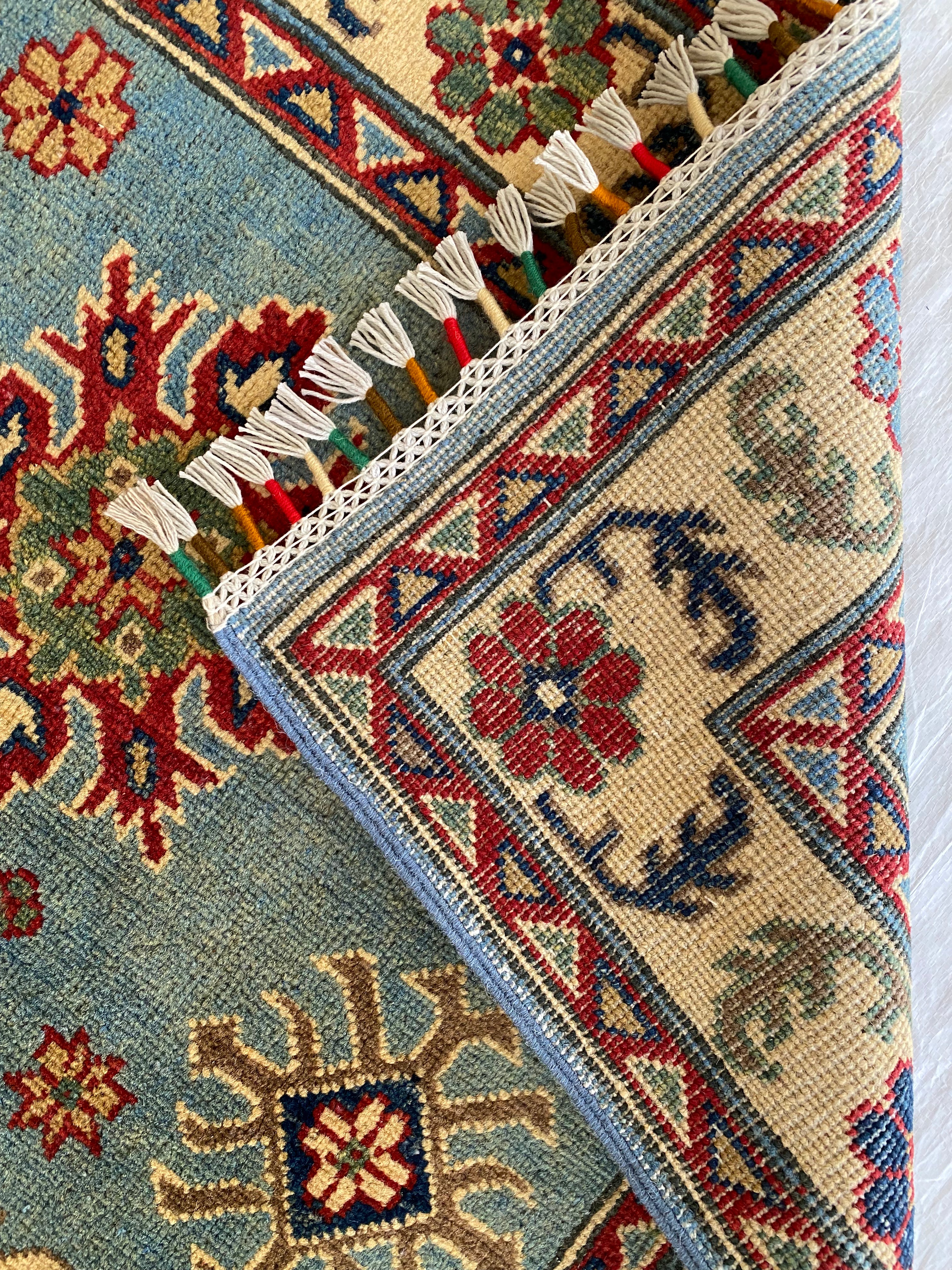 Afghani Rug 4x6 size range tribal Blue Cream laid flat