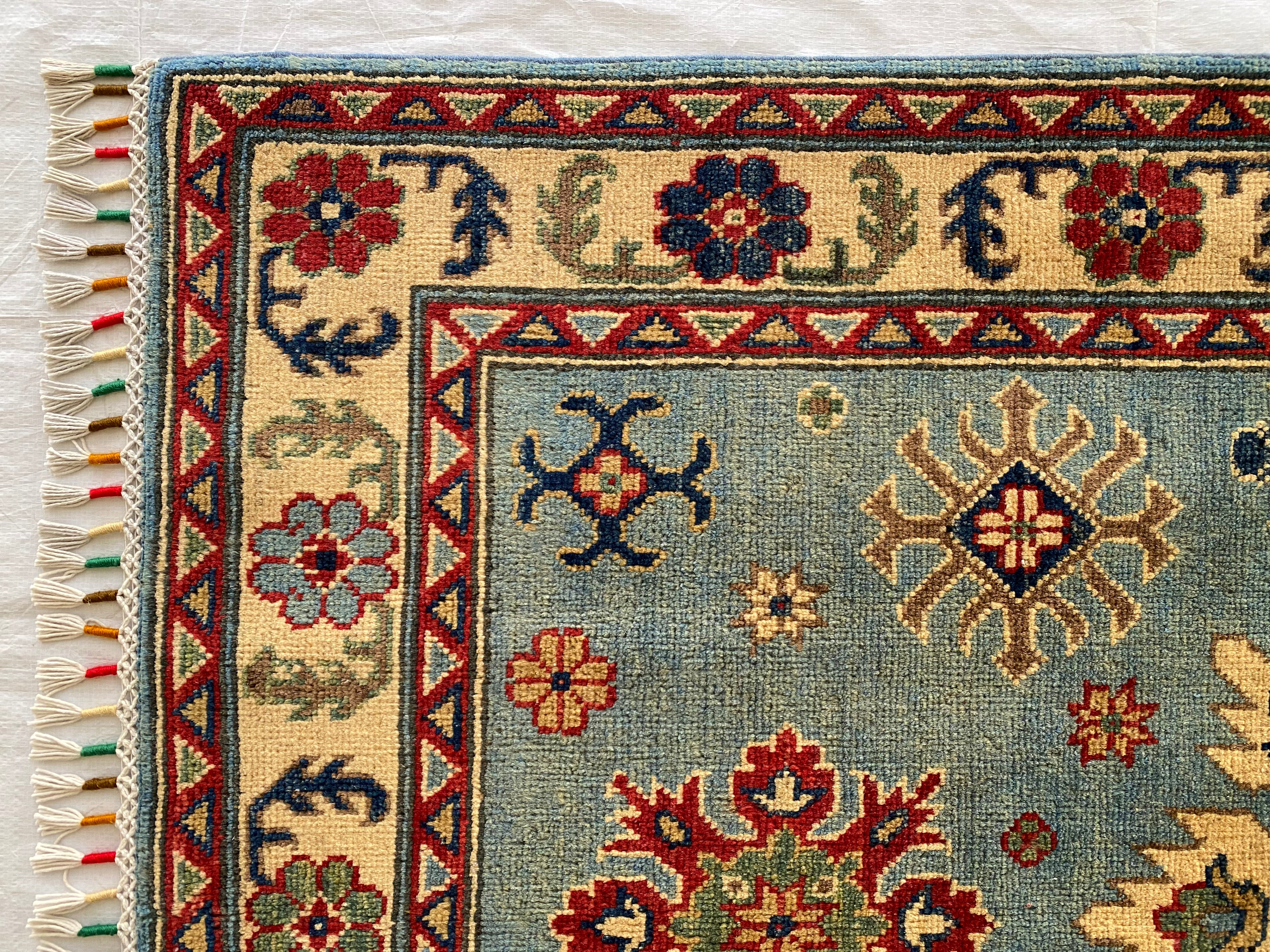 Afghani Rug 4x6 size range tribal Blue Cream laid flat