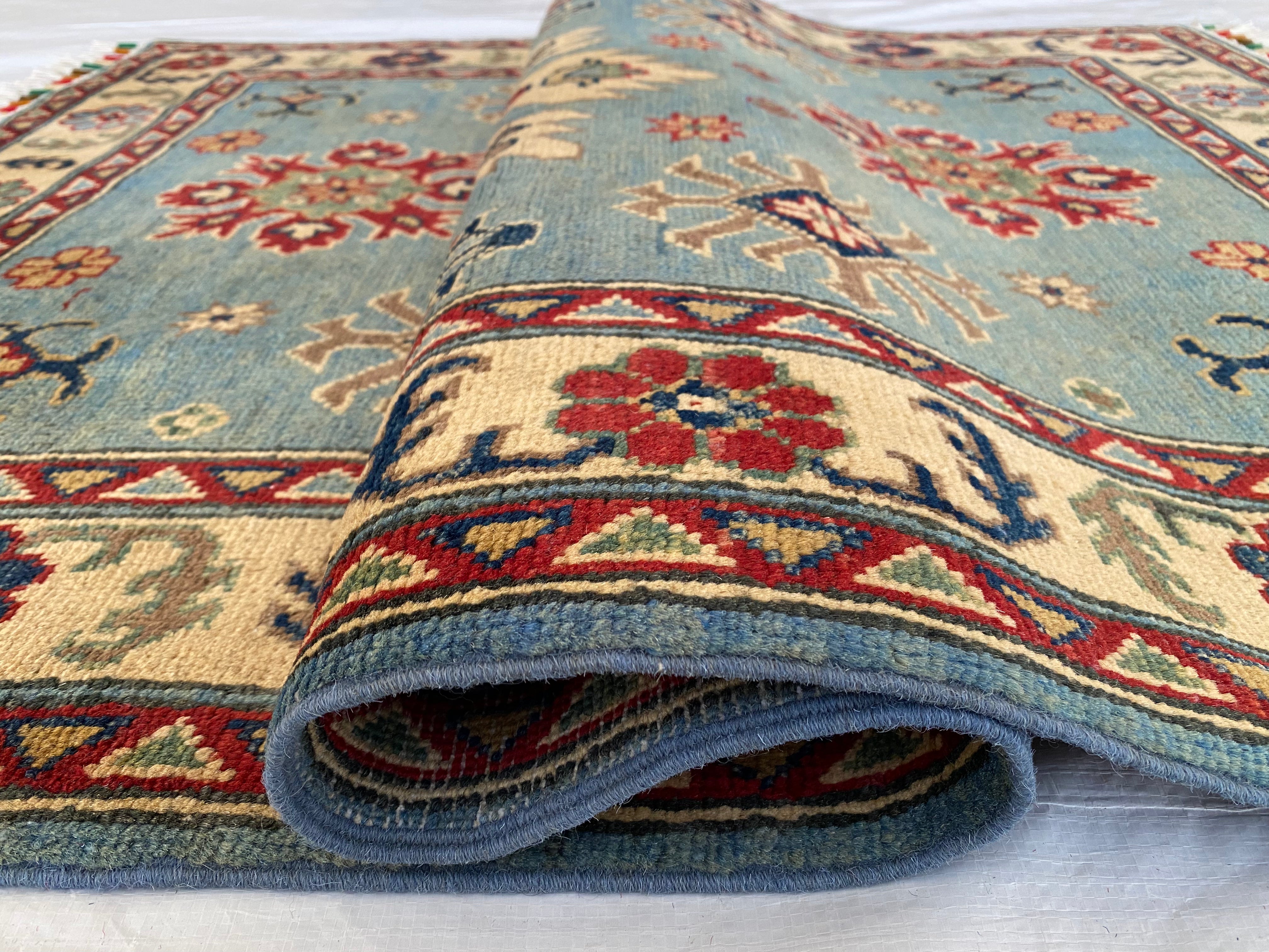 Afghani Rug 4x6 size range tribal Blue Cream laid flat
