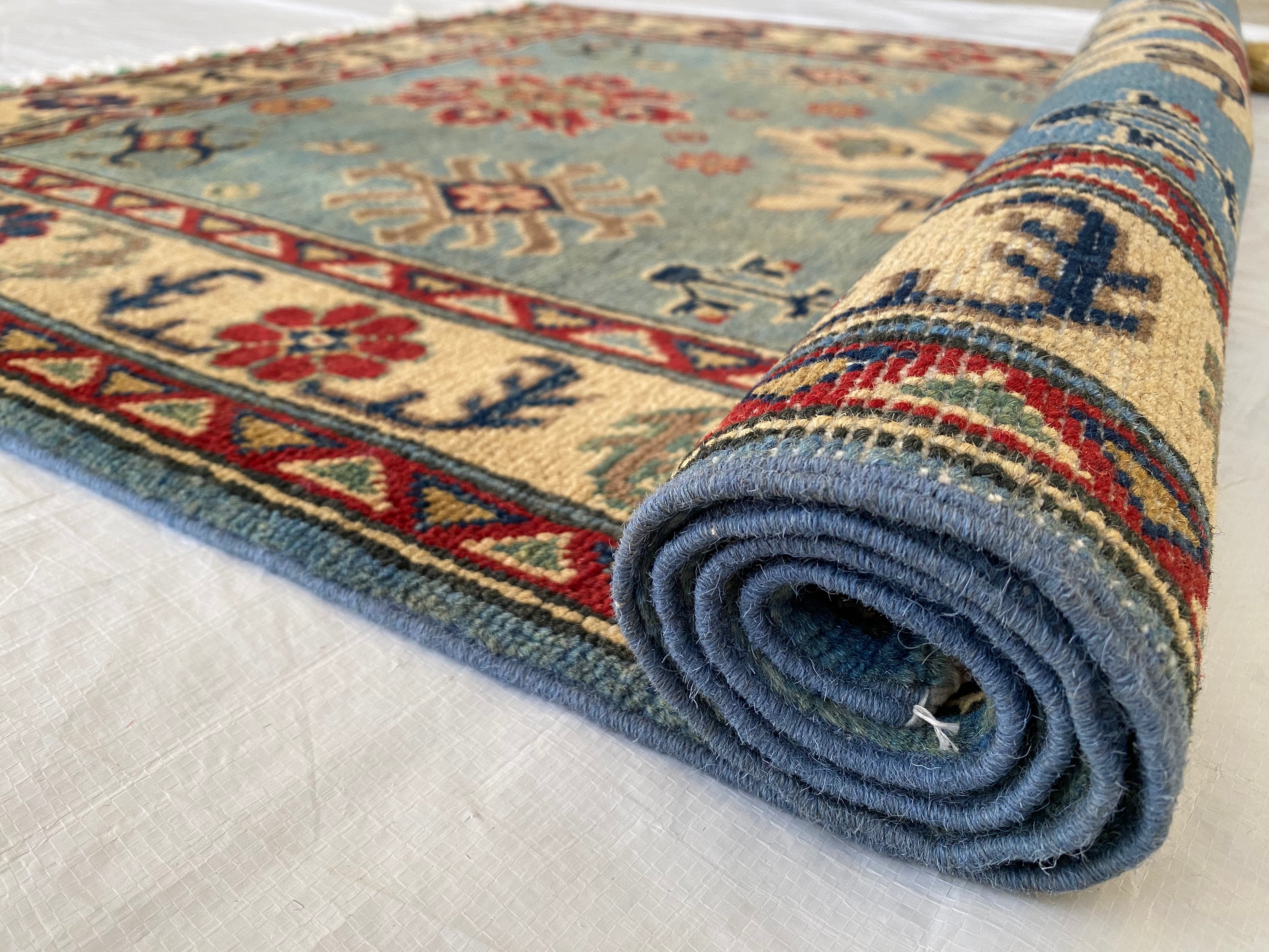 Afghani Rug 4x6 size range tribal Blue Cream laid flat