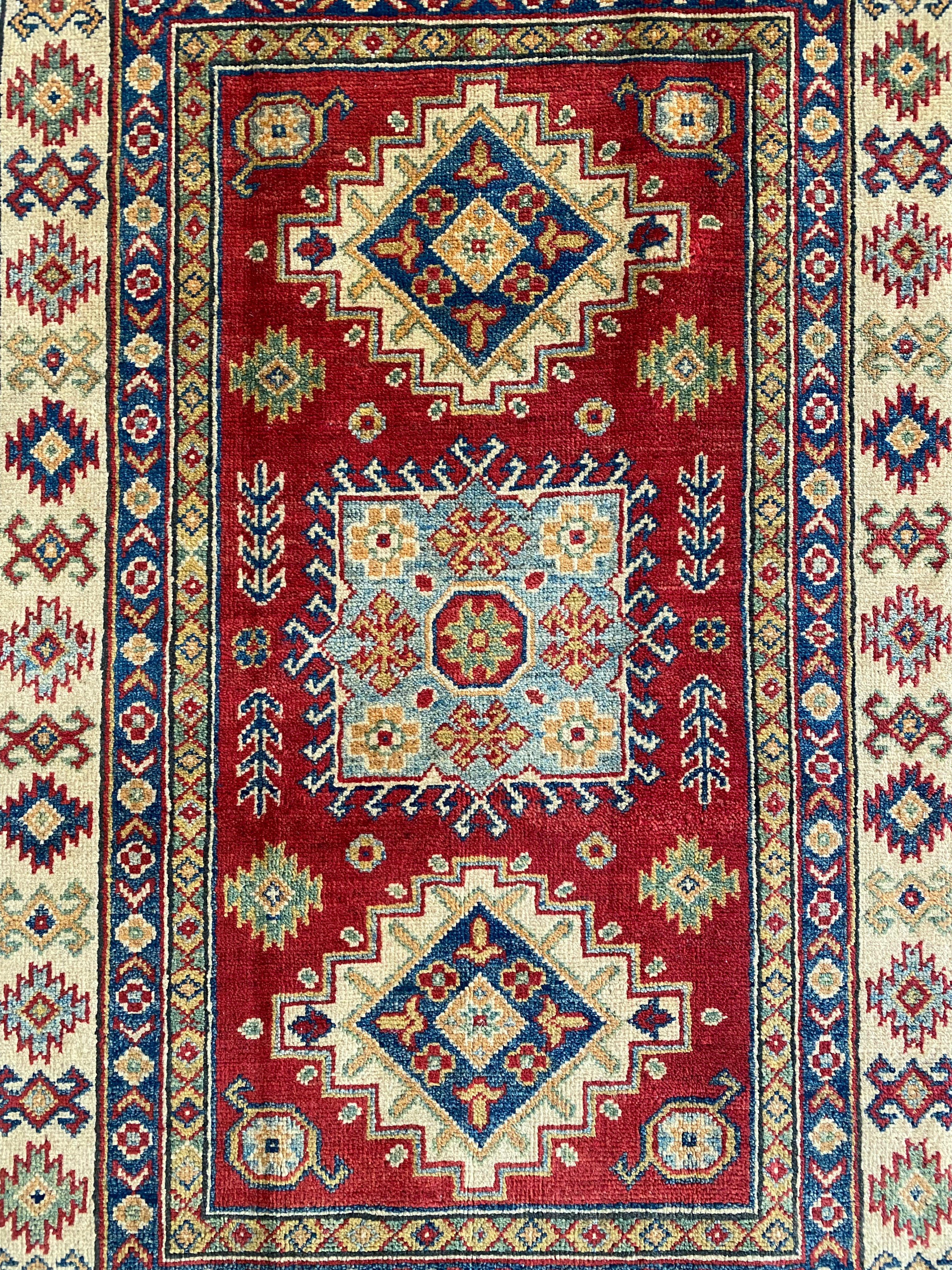 Afghani Rug 4x6 size range tribal Red Cream laid flat