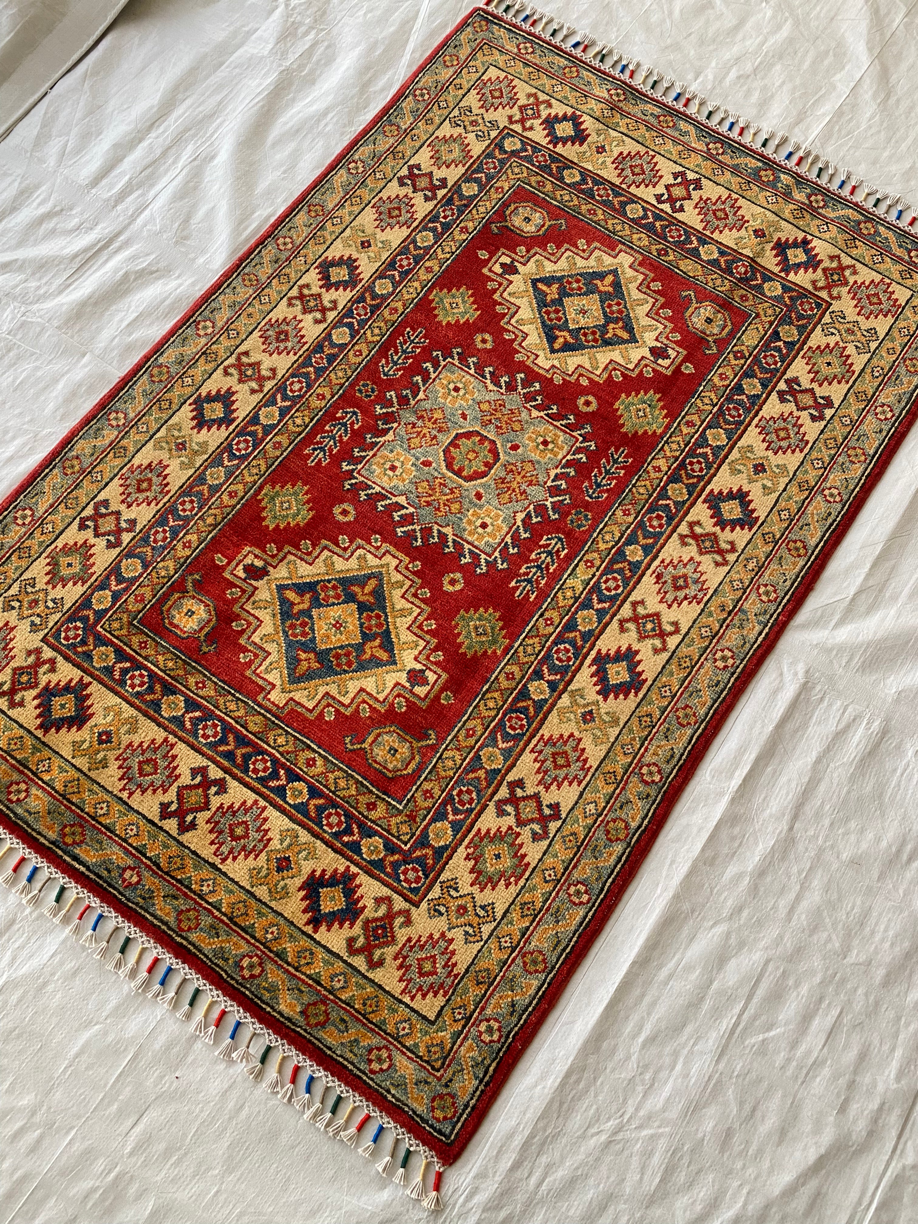 Afghani Rug 4x6 size range tribal Red Cream laid flat