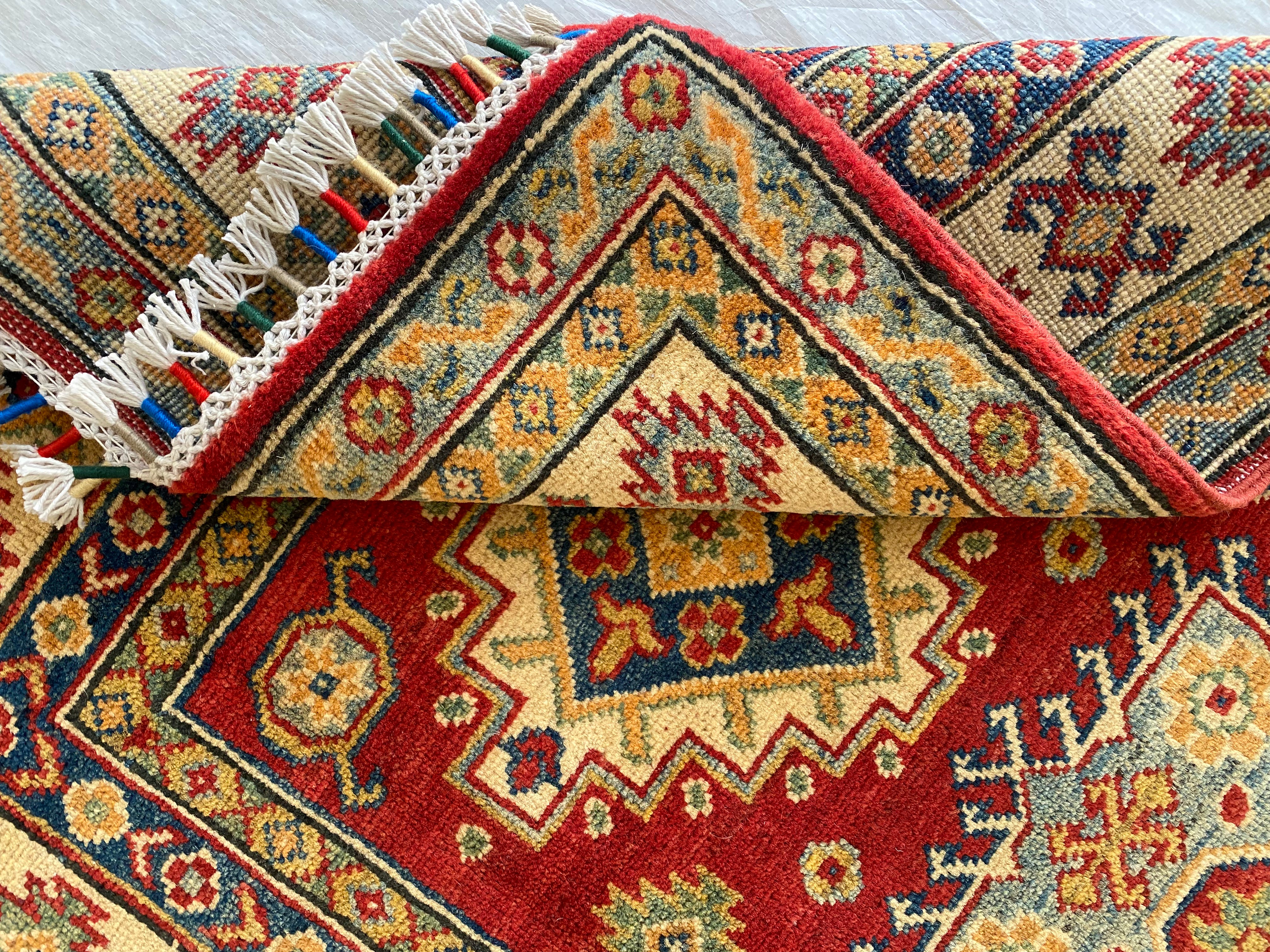 Afghani Rug 4x6 size range tribal Red Cream laid flat