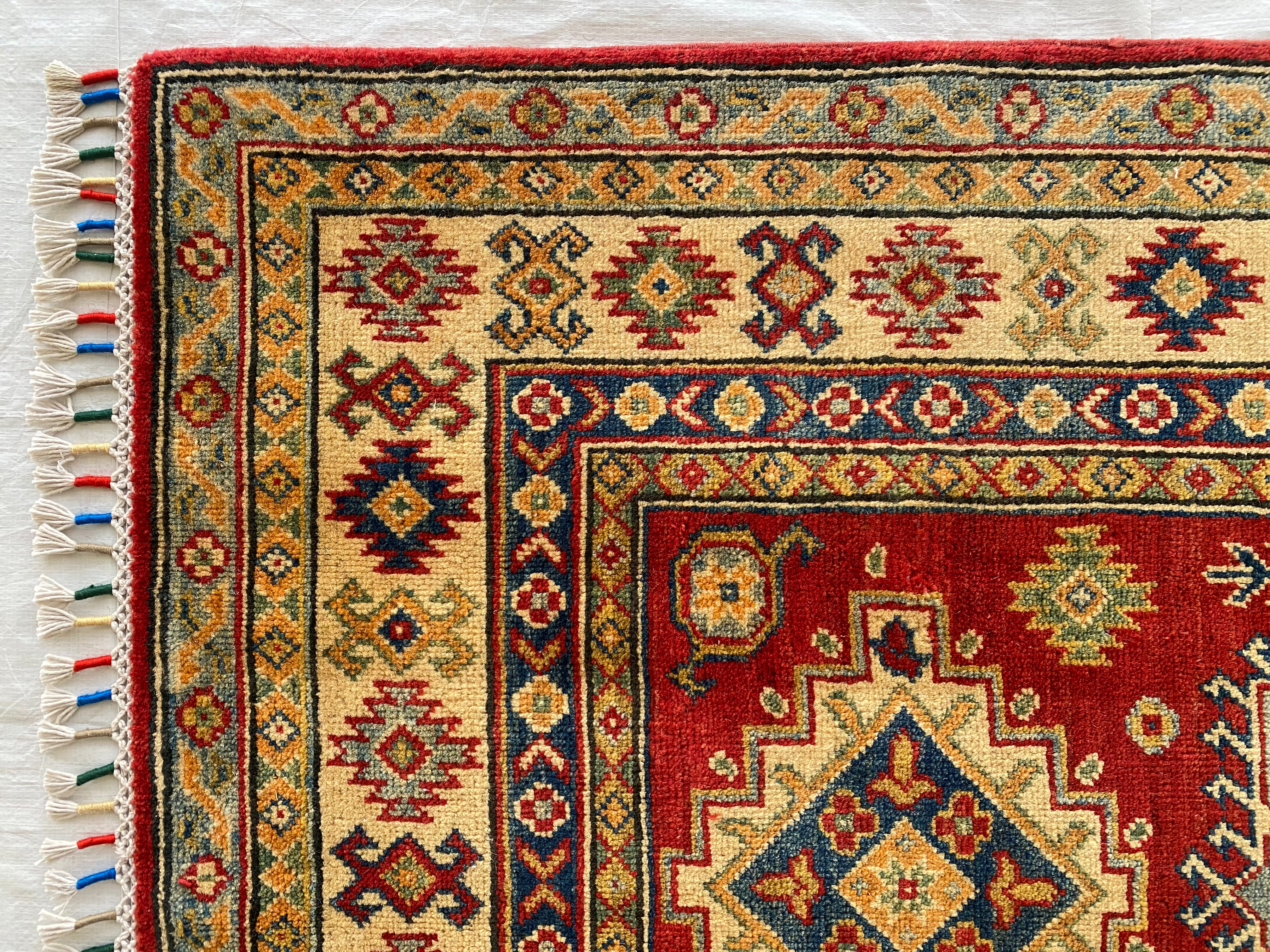 Afghani Rug 4x6 size range tribal Red Cream laid flat