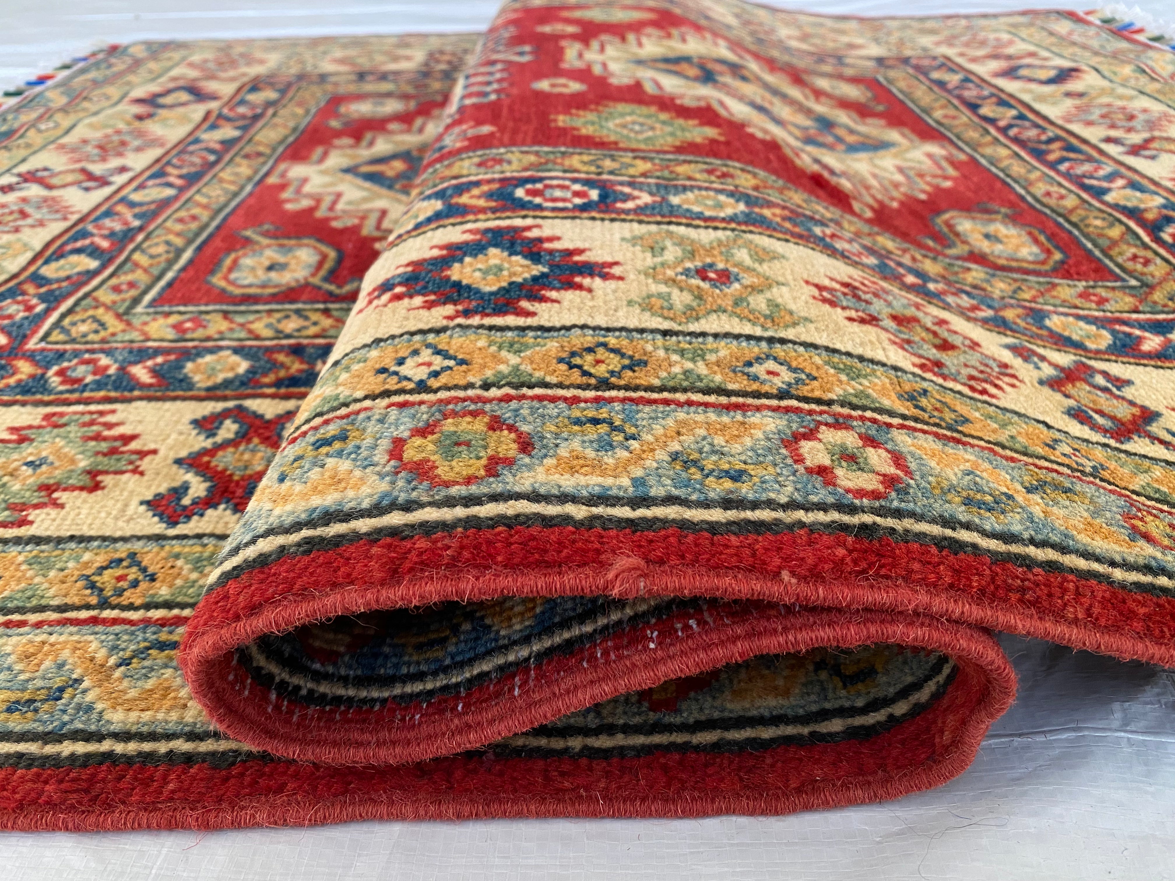Afghani Rug 4x6 size range tribal Red Cream laid flat