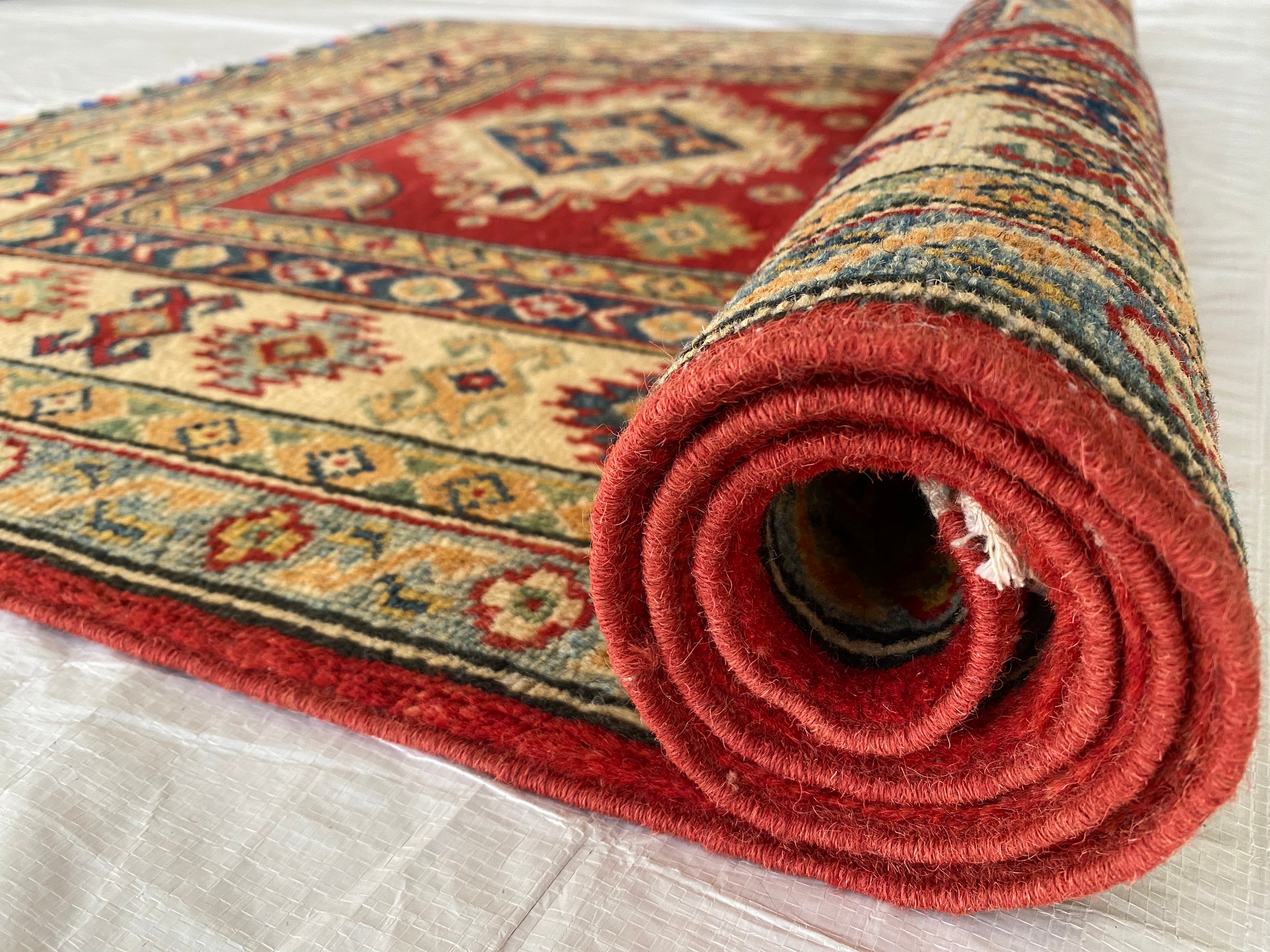 Afghani Rug 4x6 size range tribal Red Cream laid flat
