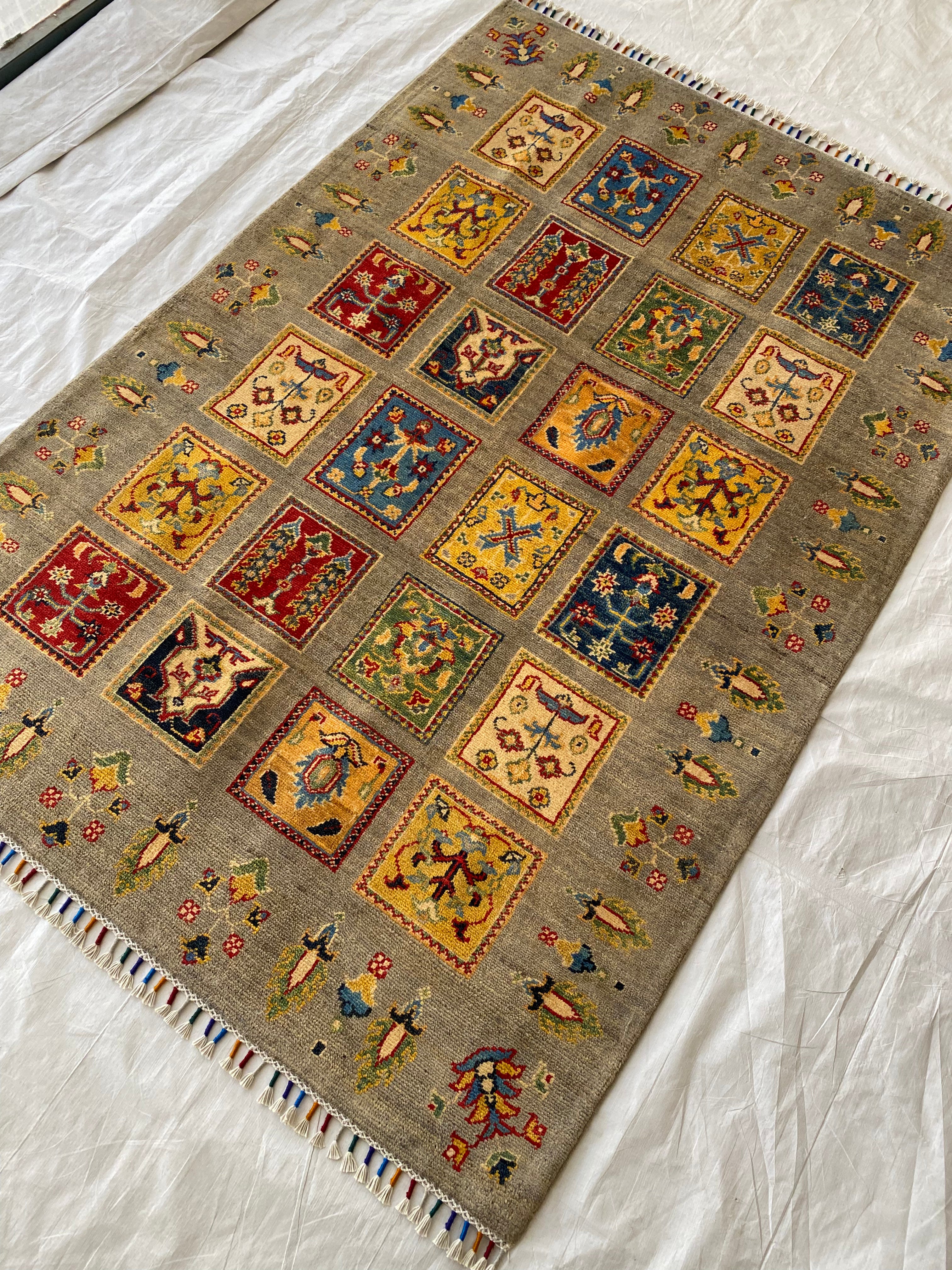 Afghani Rug 5x8 size range tribal Brown laid flat