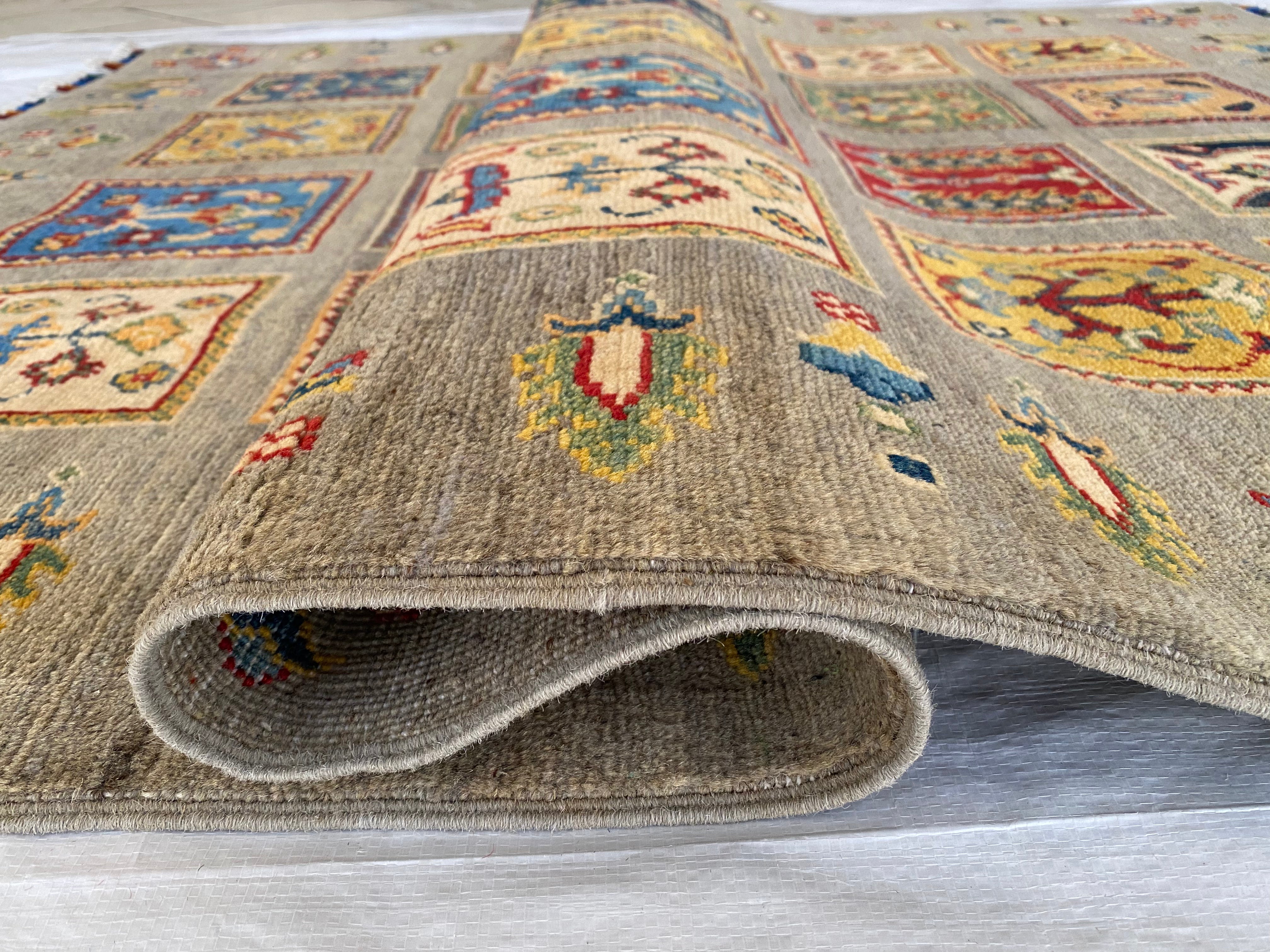 Afghani Rug 5x8 size range tribal Brown laid flat