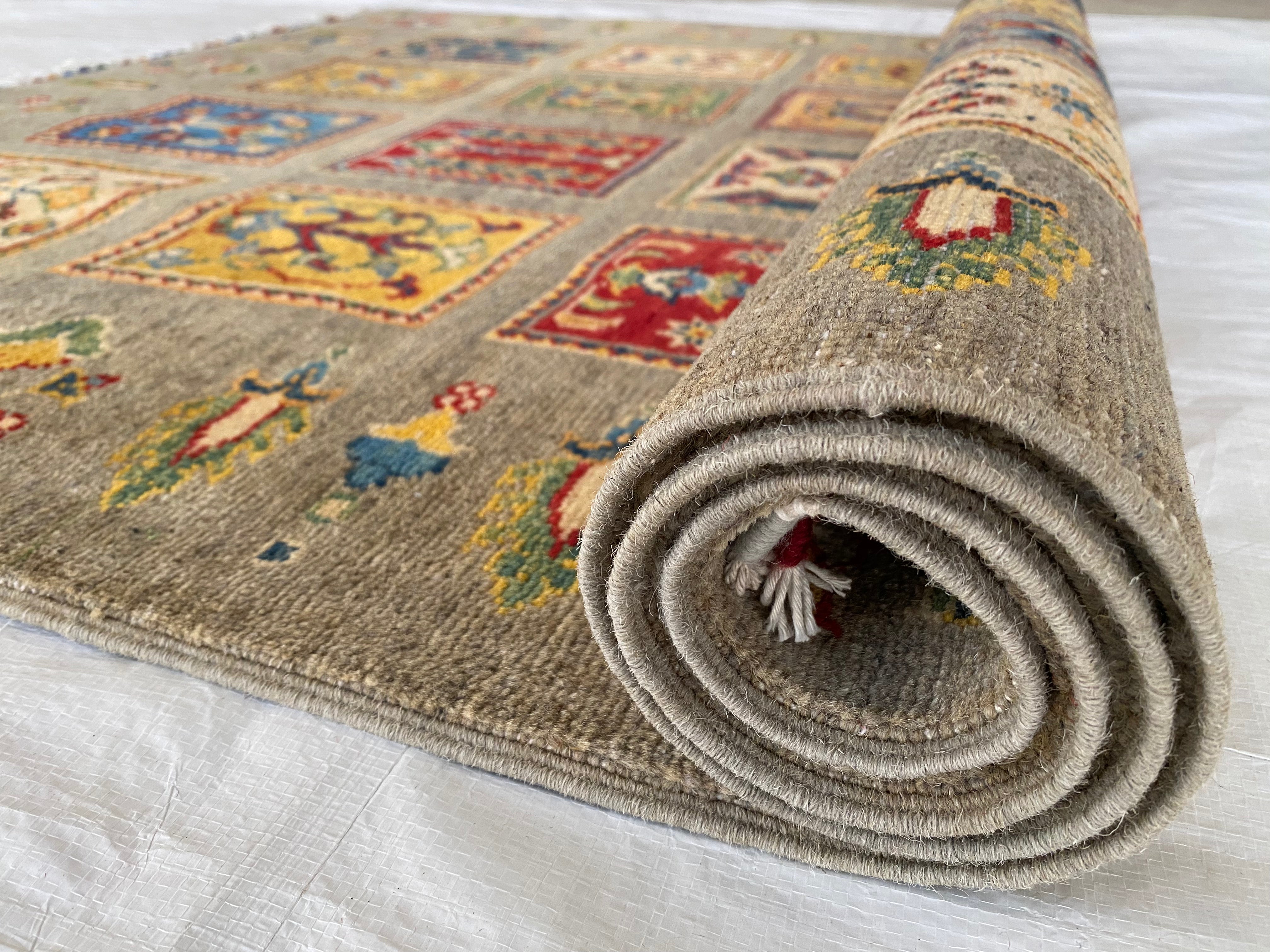 Afghani Rug 5x8 size range tribal Brown laid flat