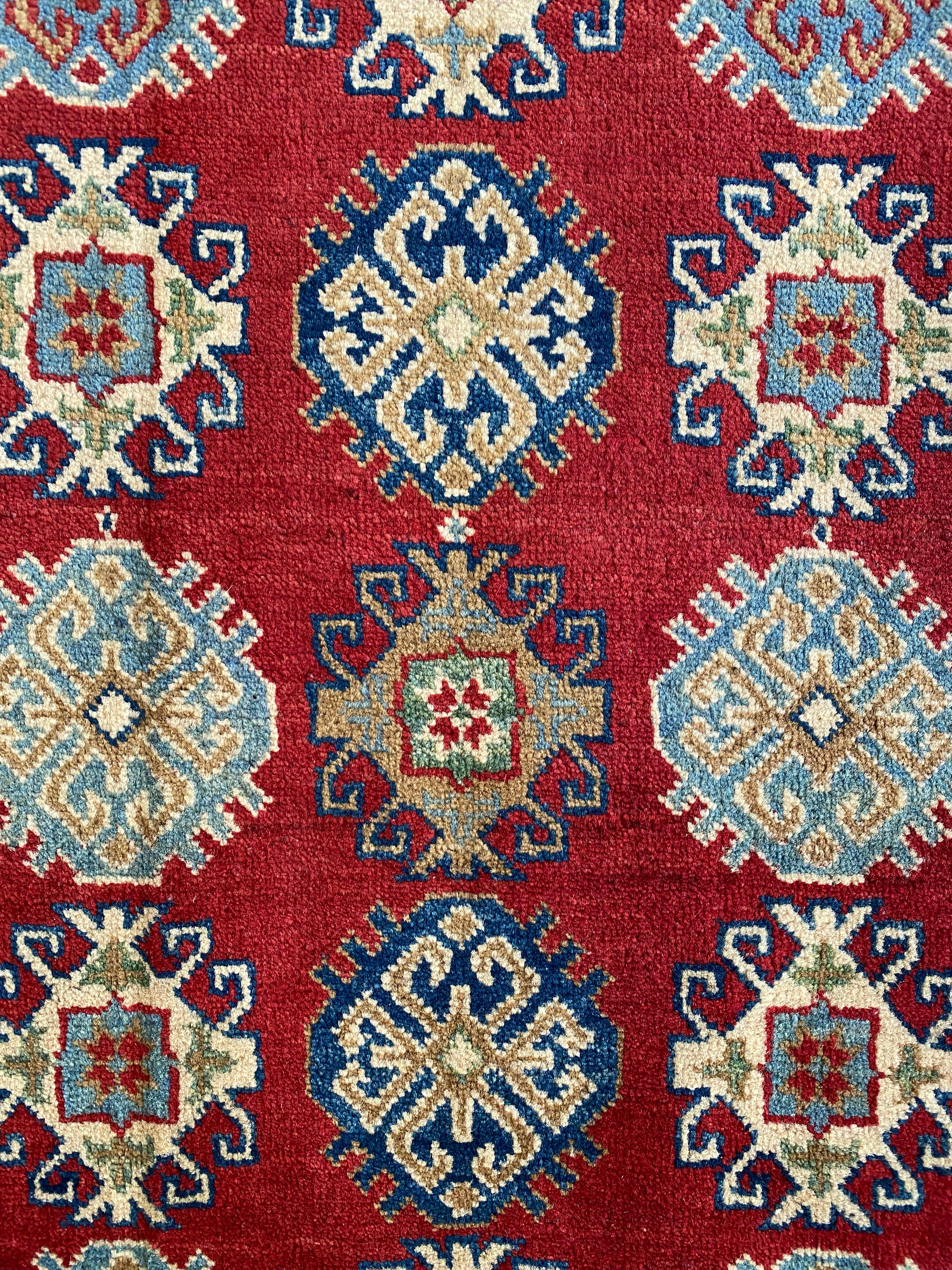 Afghani Rug 4x6 size range tribal Red Cream laid flat