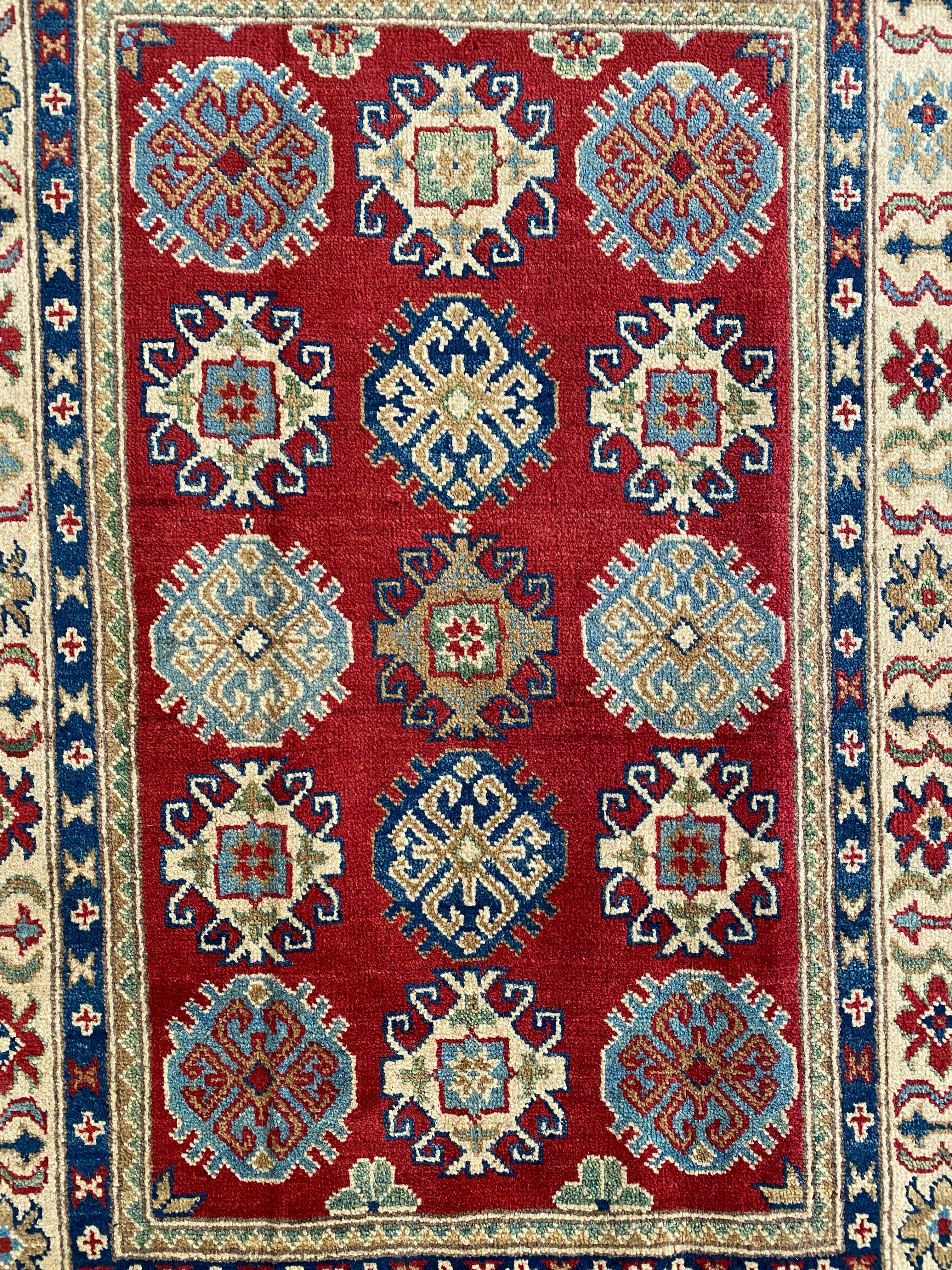 Afghani Rug 4x6 size range tribal Red Cream laid flat