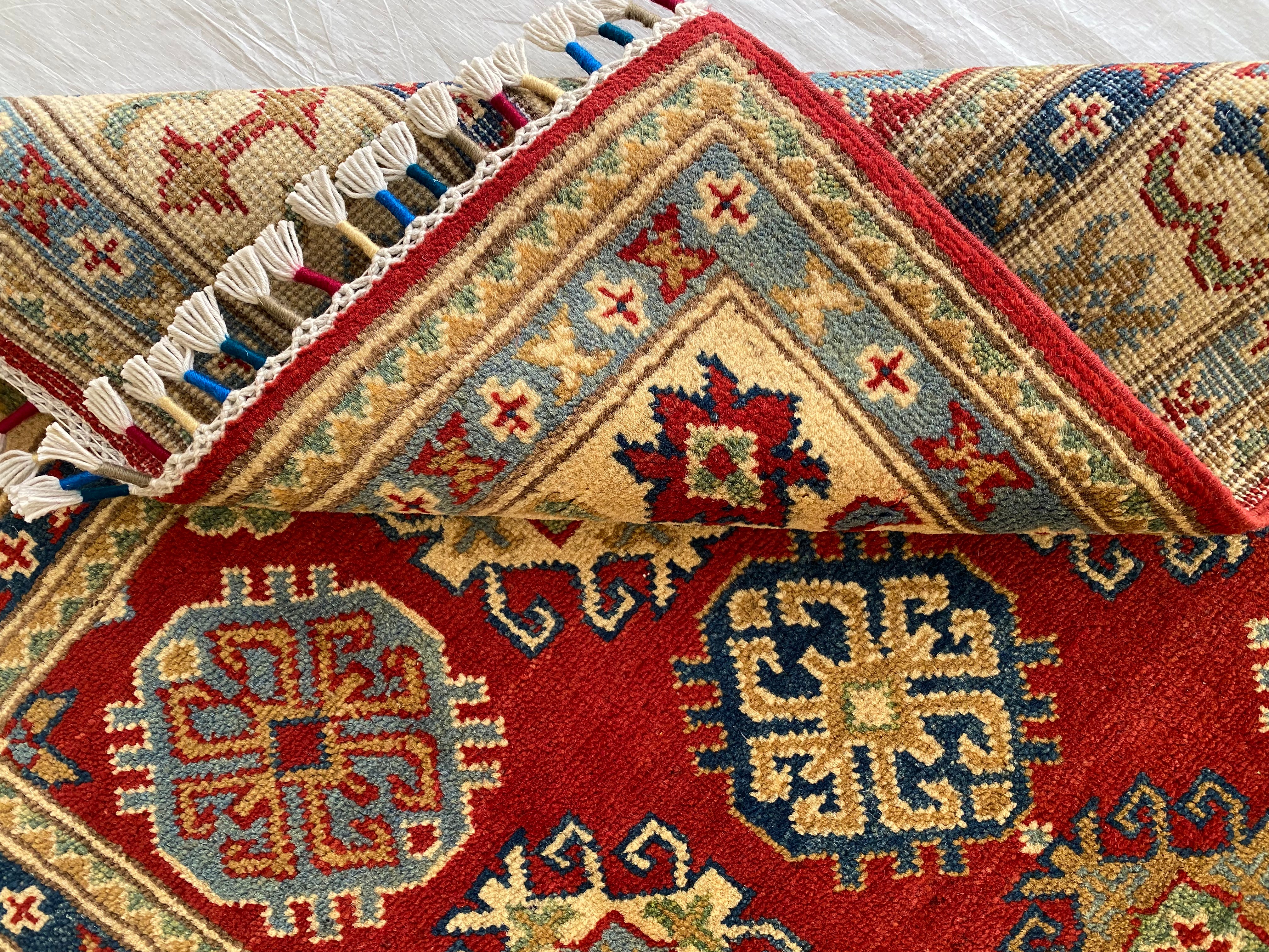 Afghani Rug 4x6 size range tribal Red Cream laid flat