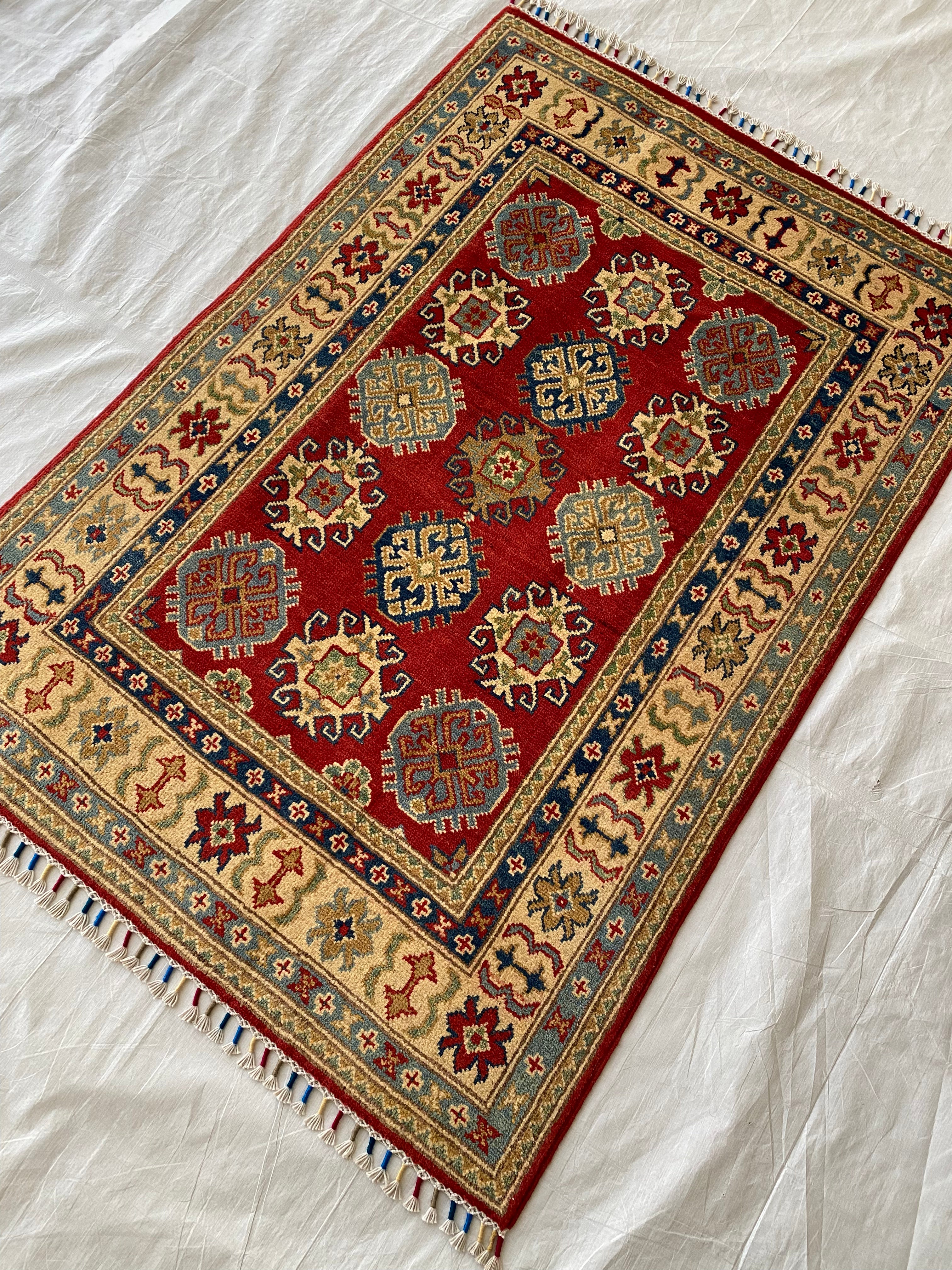 Afghani Rug 4x6 size range tribal Red Cream laid flat