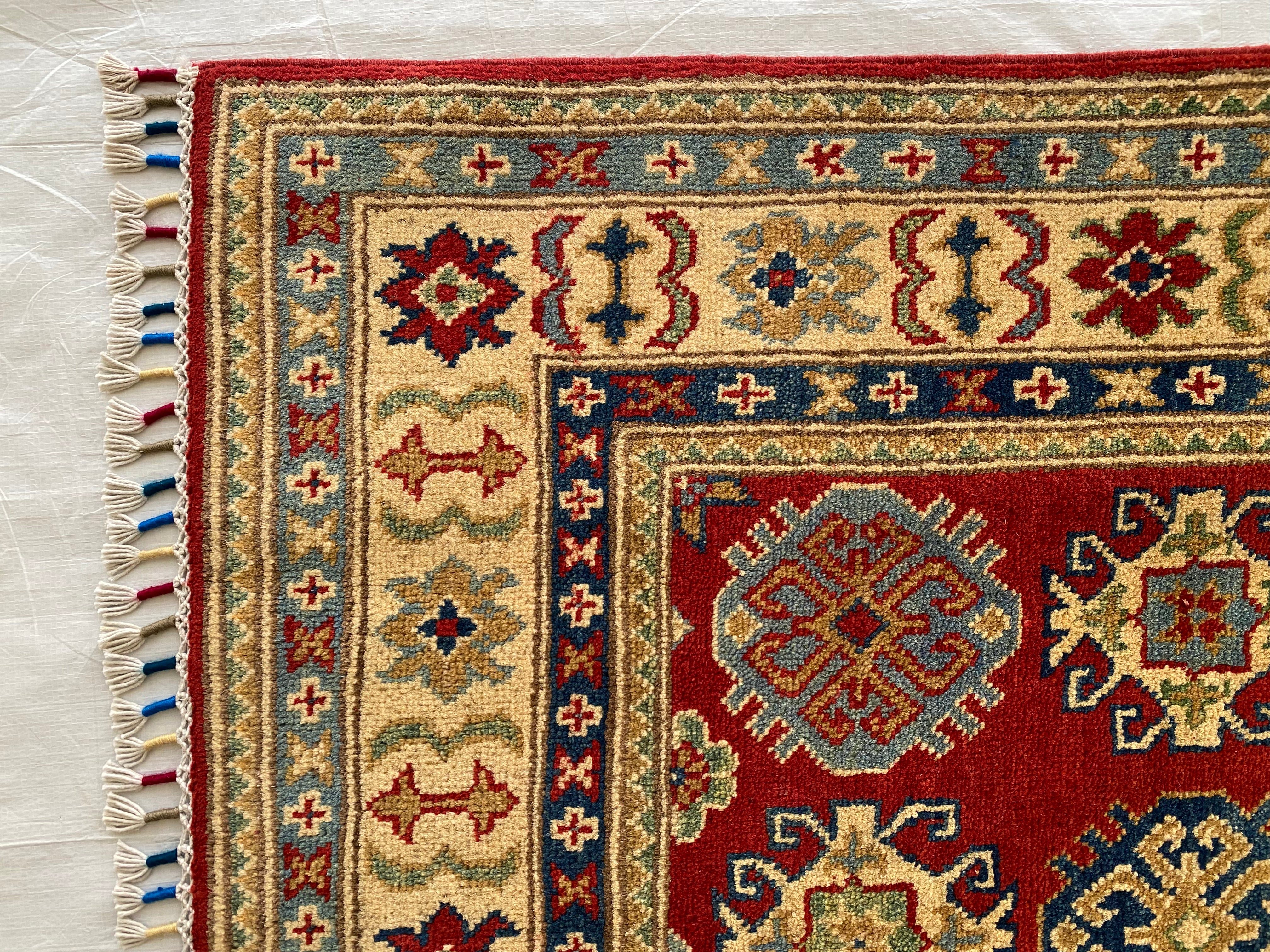 Afghani Rug 4x6 size range tribal Red Cream laid flat