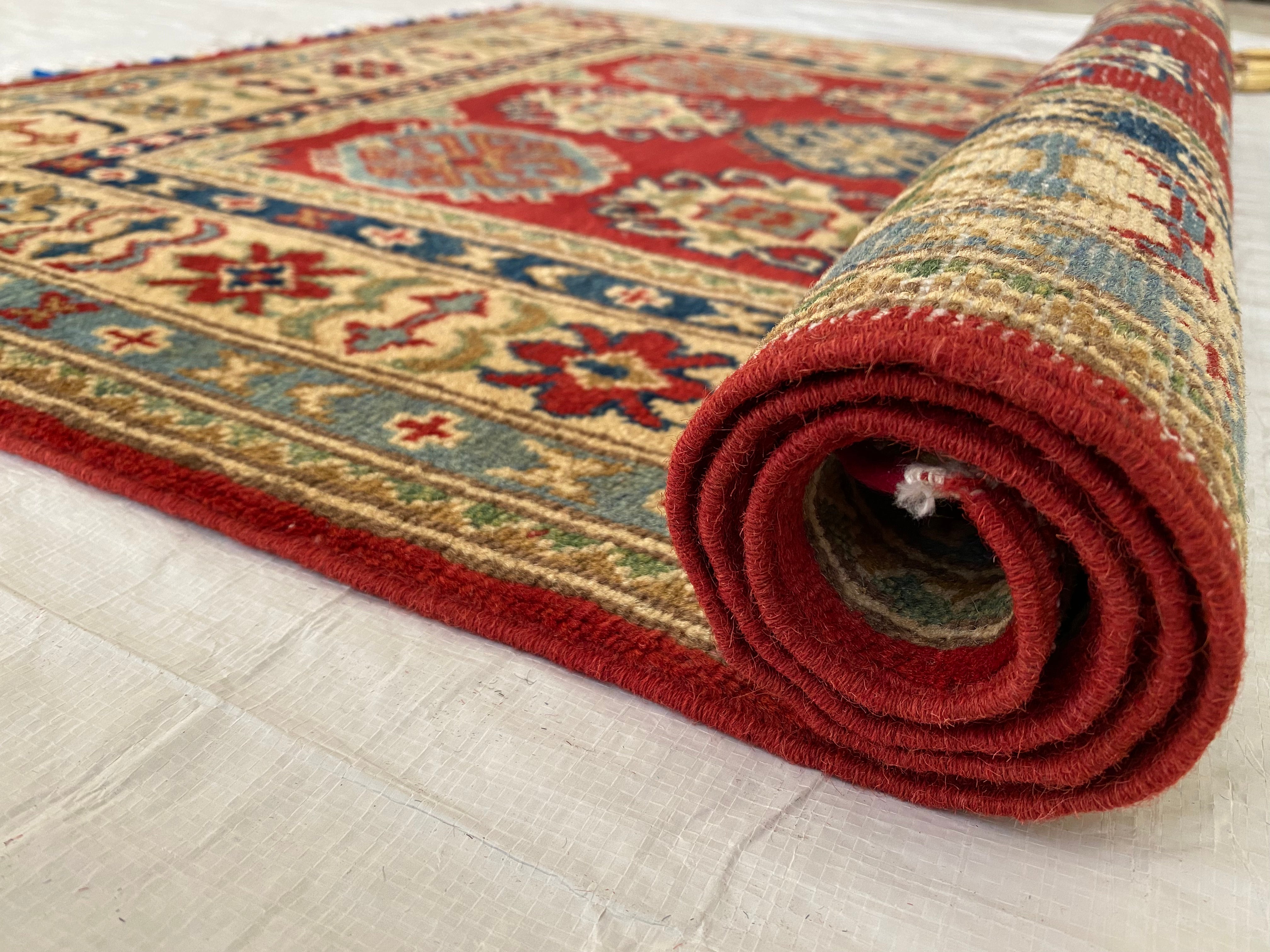 Afghani Rug 4x6 size range tribal Red Cream laid flat