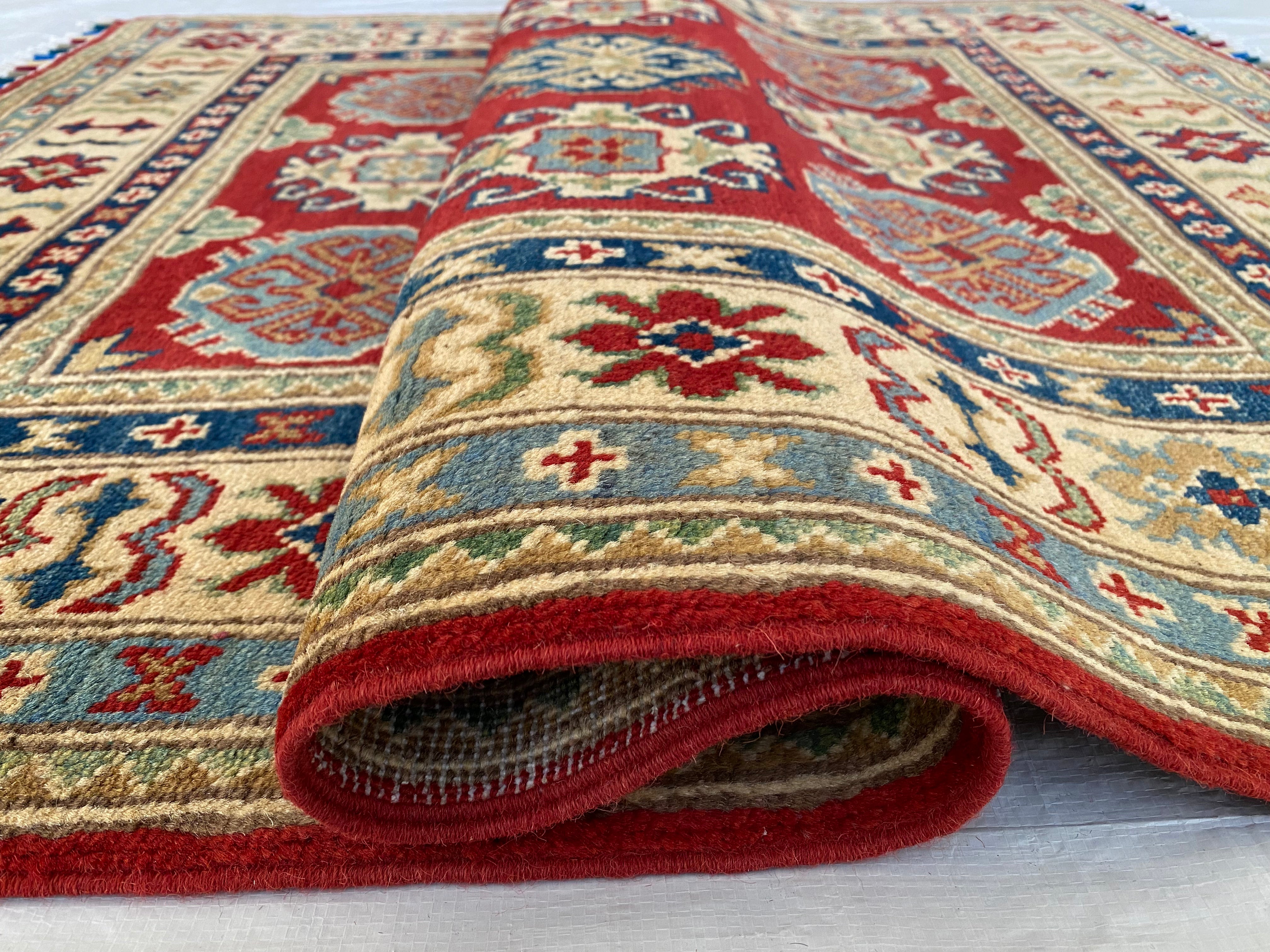 Afghani Rug 4x6 size range tribal Red Cream laid flat