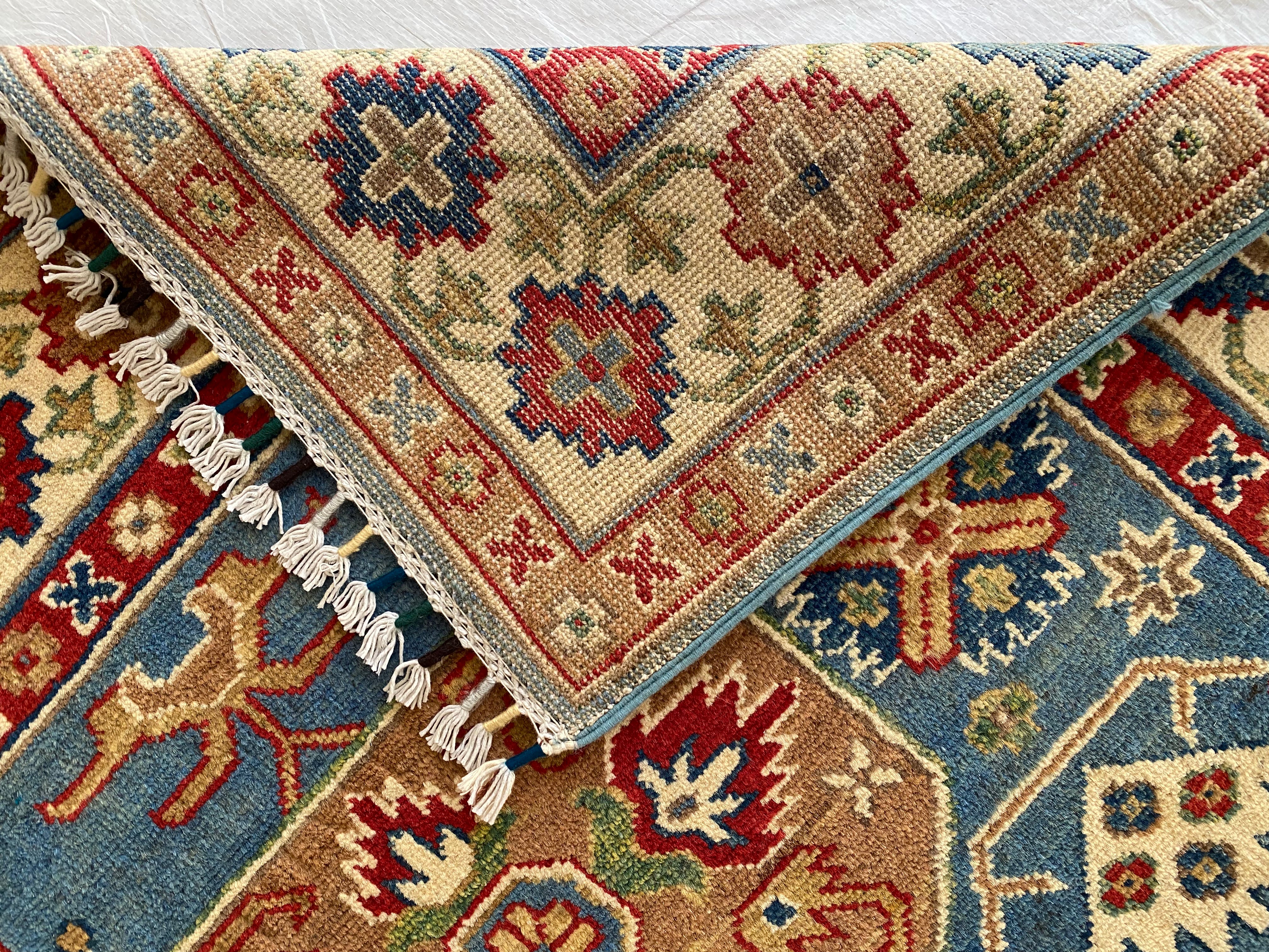Afghani Rug 4x6 size range tribal Blue Cream laid flat