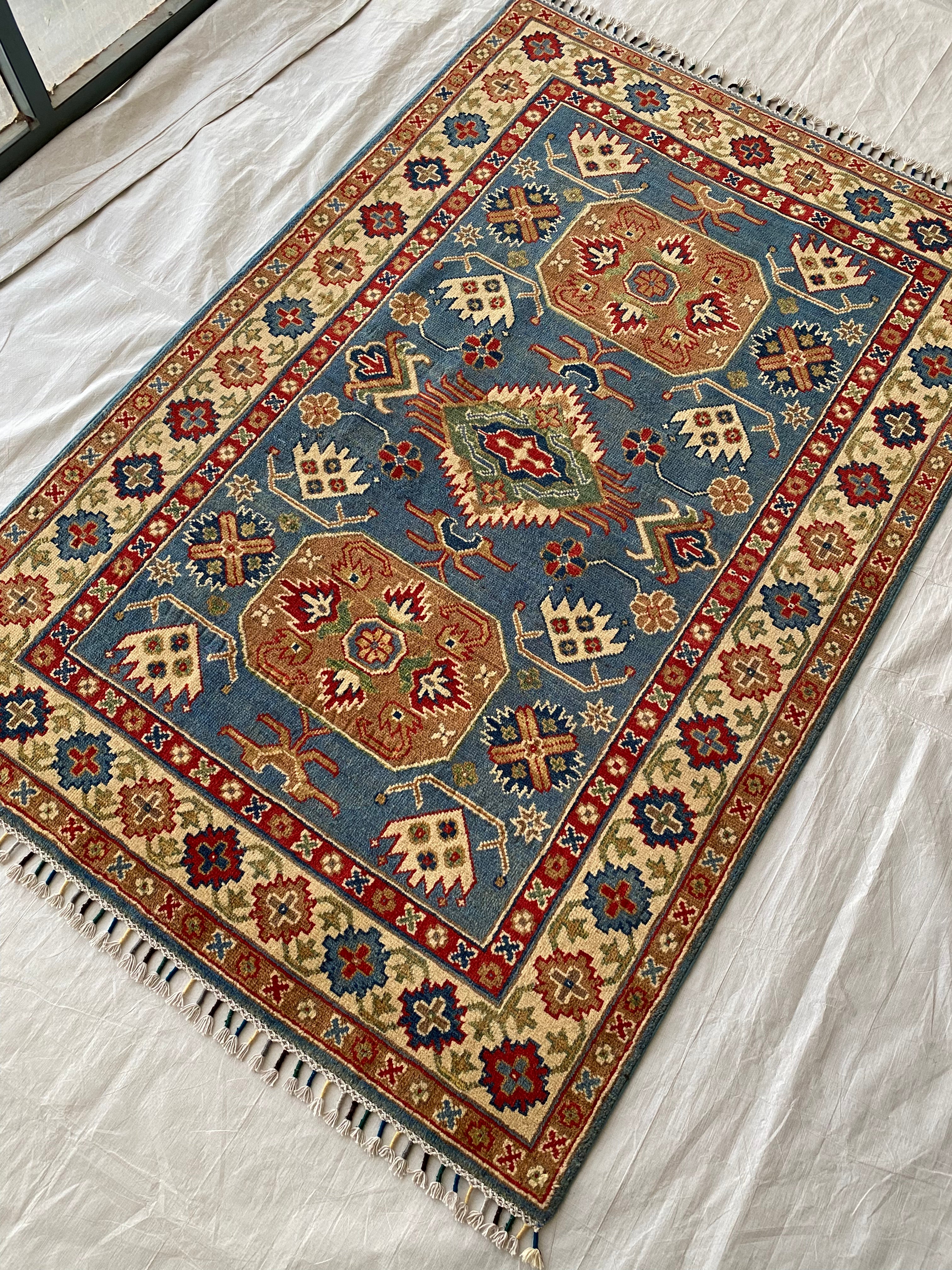 Afghani Rug 4x6 size range tribal Blue Cream laid flat