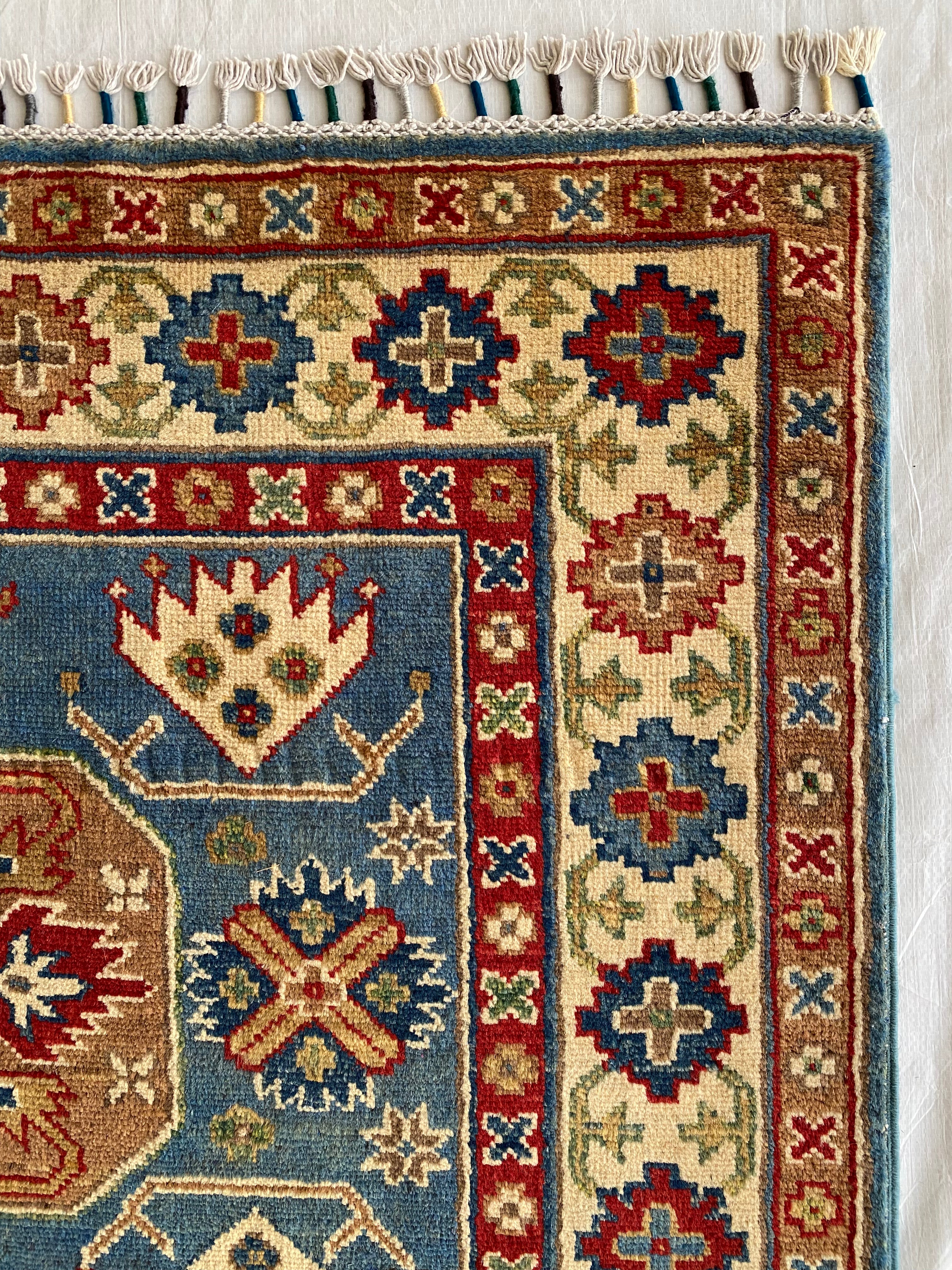 Afghani Rug 4x6 size range tribal Blue Cream laid flat