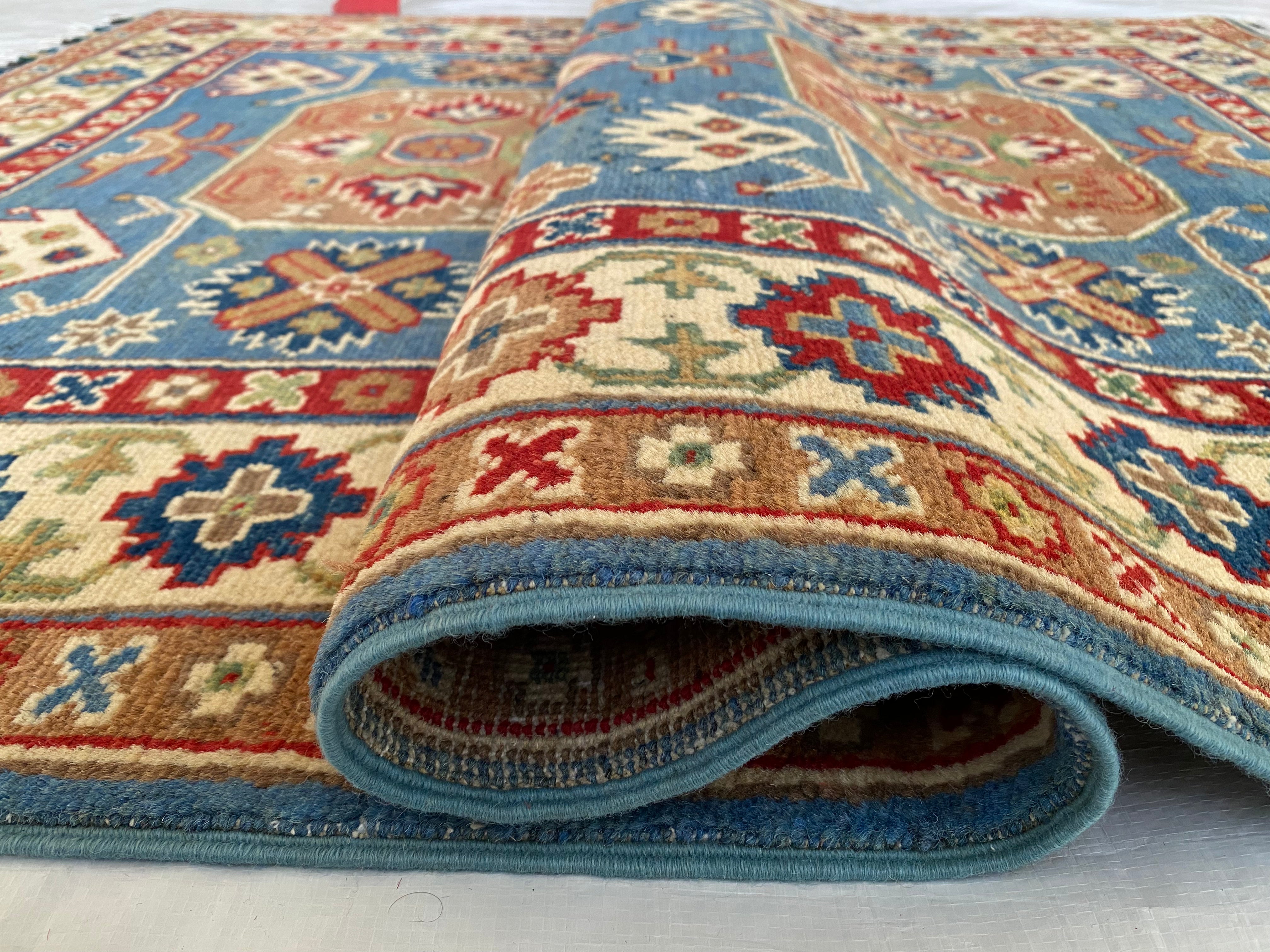 Afghani Rug 4x6 size range tribal Blue Cream laid flat