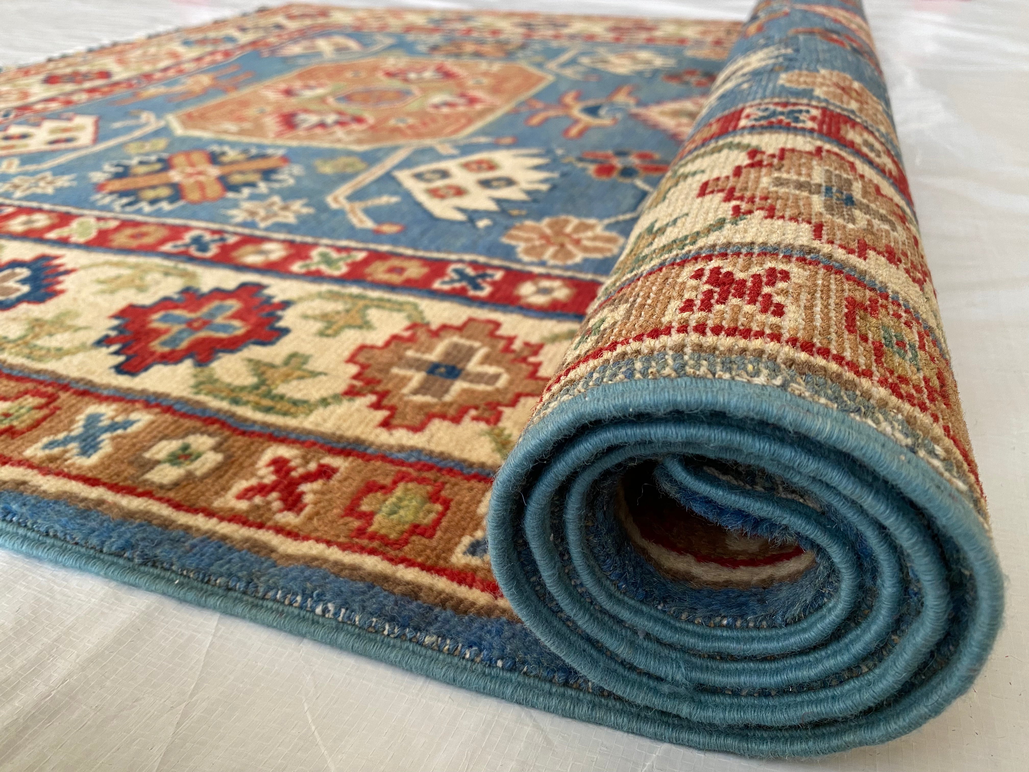 Afghani Rug 4x6 size range tribal Blue Cream laid flat