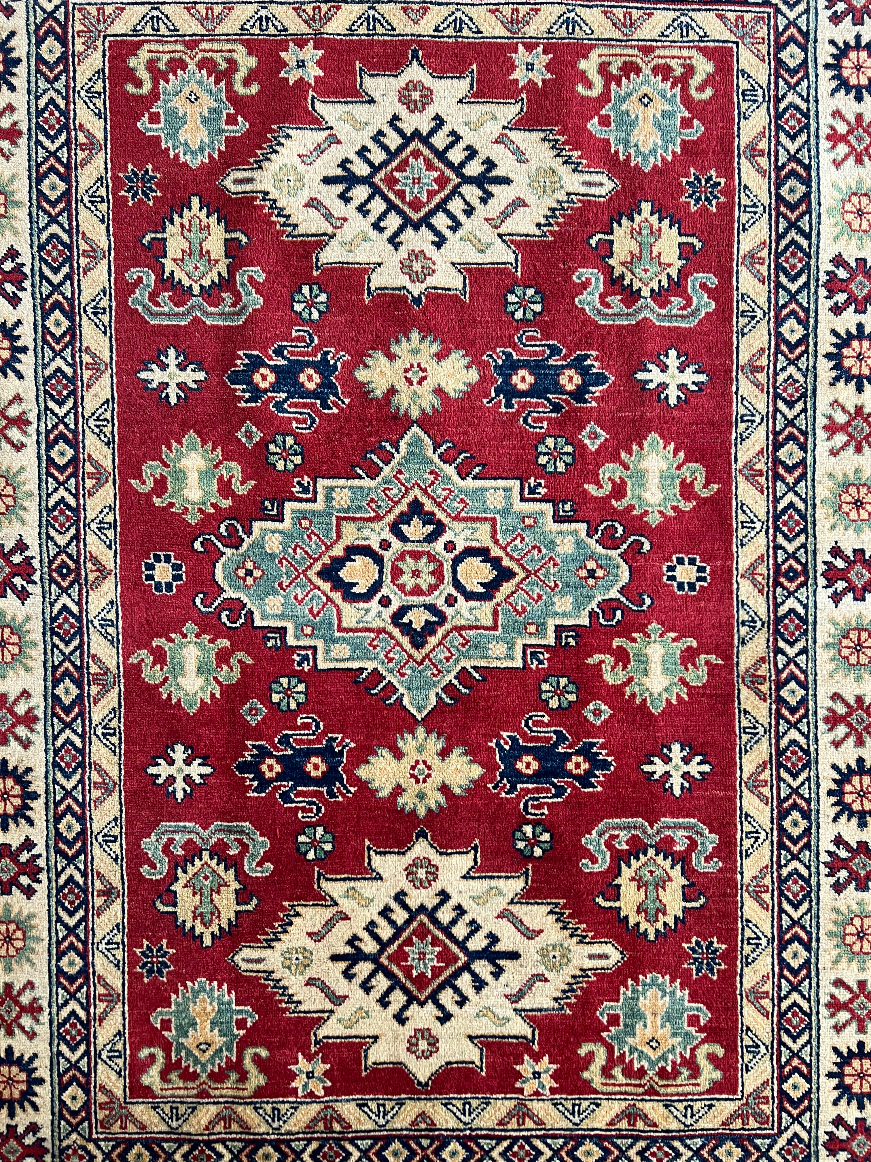 Afghani Rug 5x8 size range tribal Red Cream laid flat