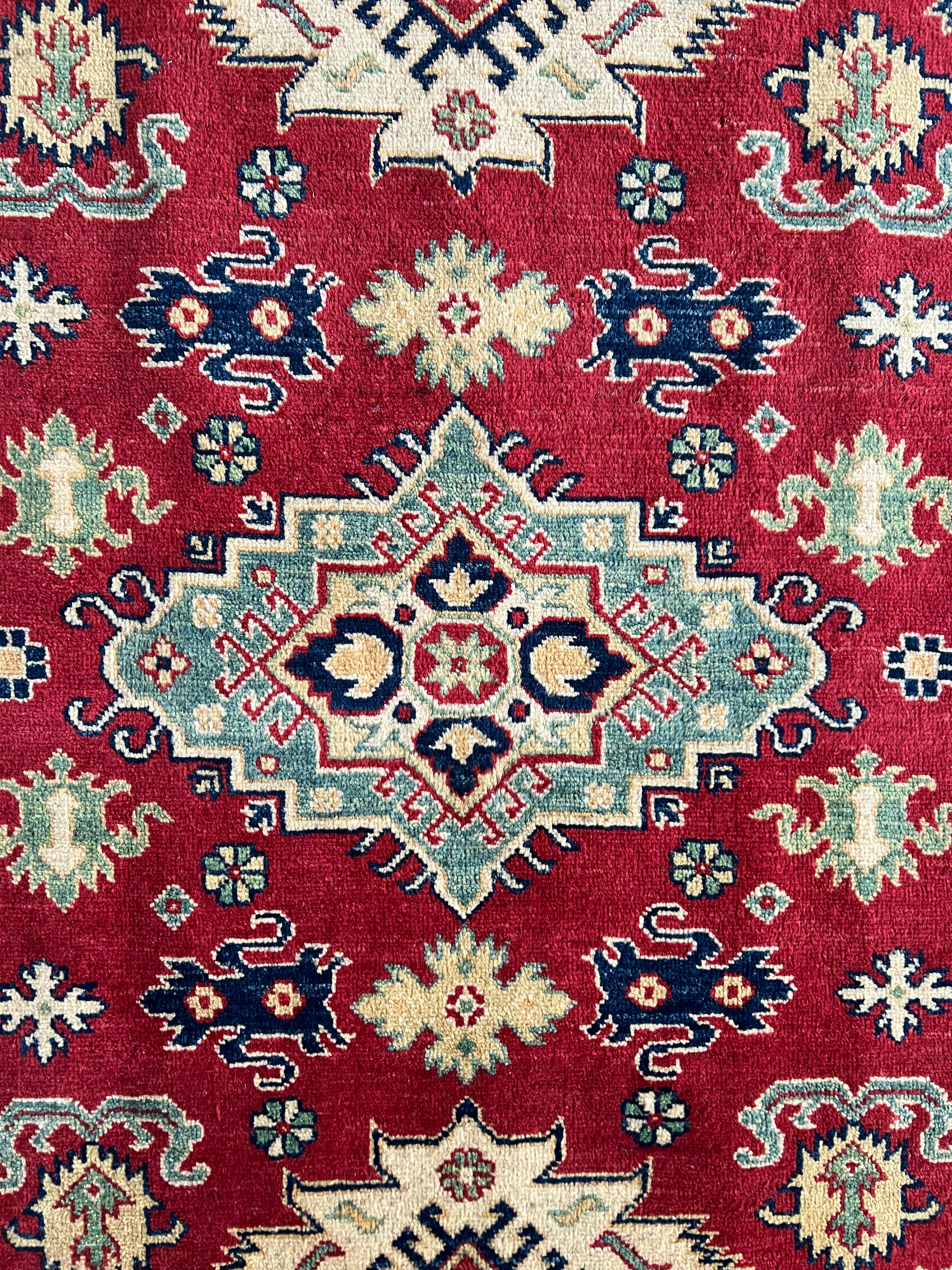 Afghani Rug 5x8 size range tribal Red Cream laid flat