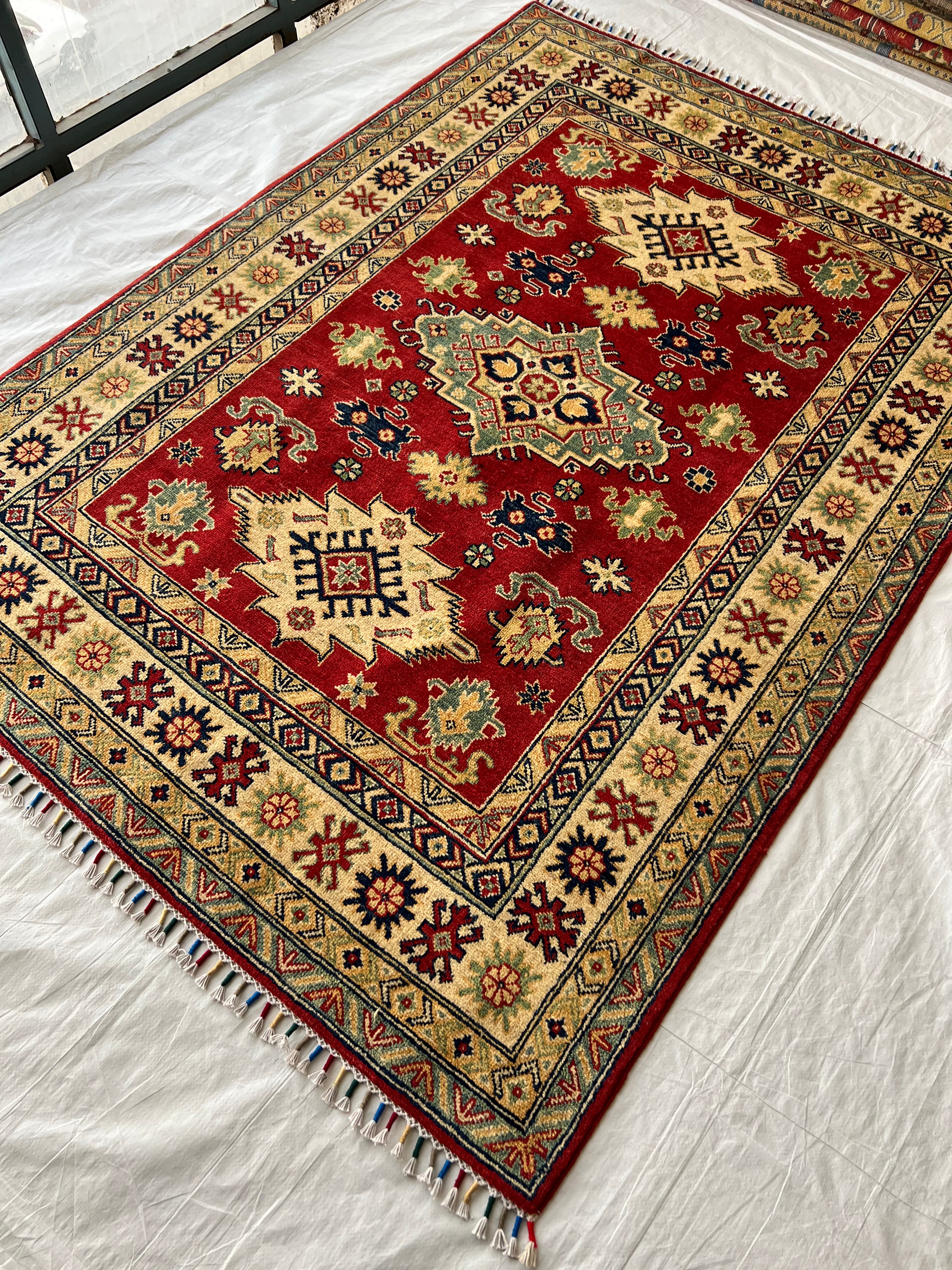 Afghani Rug 5x8 size range tribal Red Cream laid flat