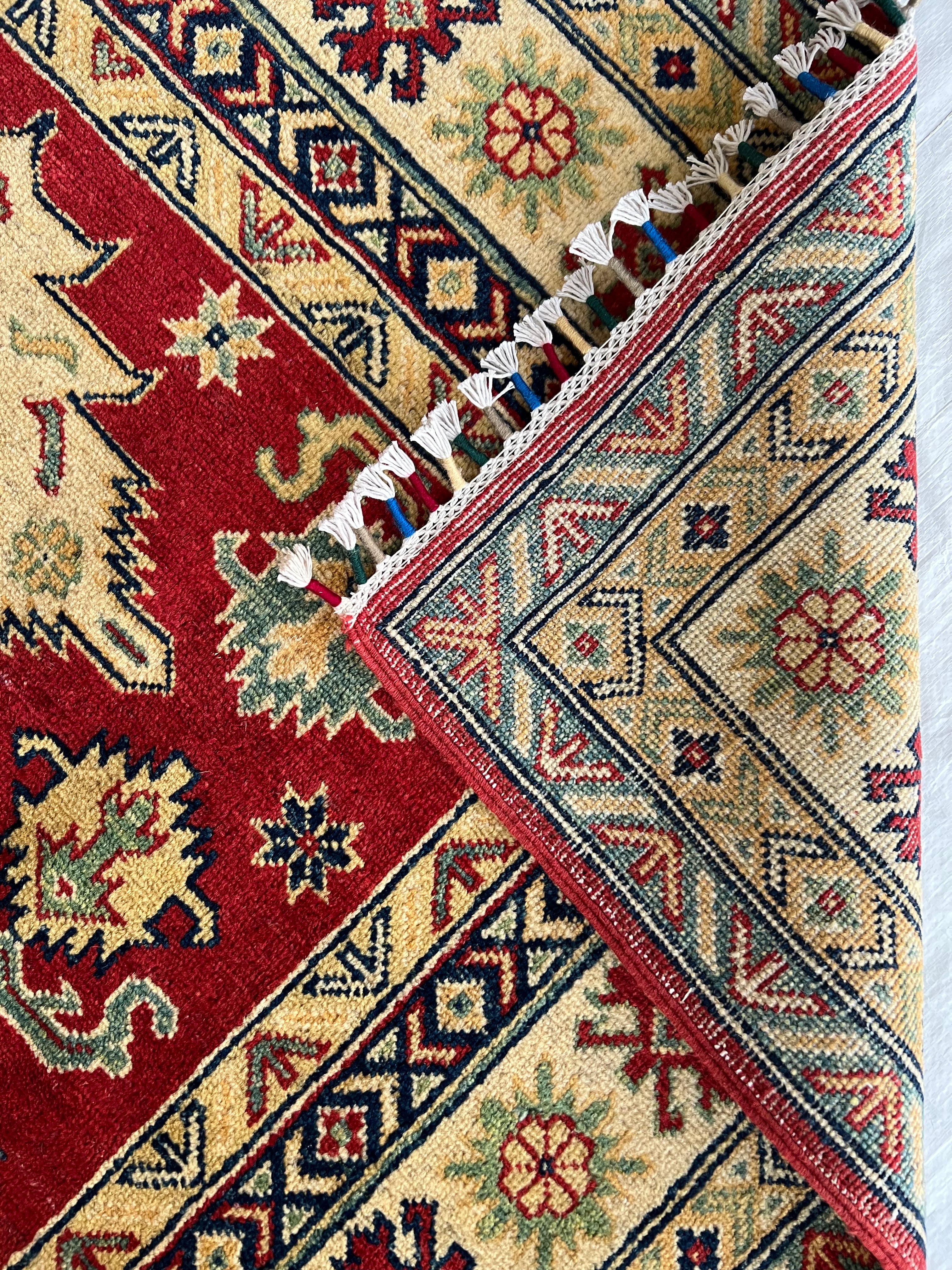 Afghani Rug 5x8 size range tribal Red Cream laid flat