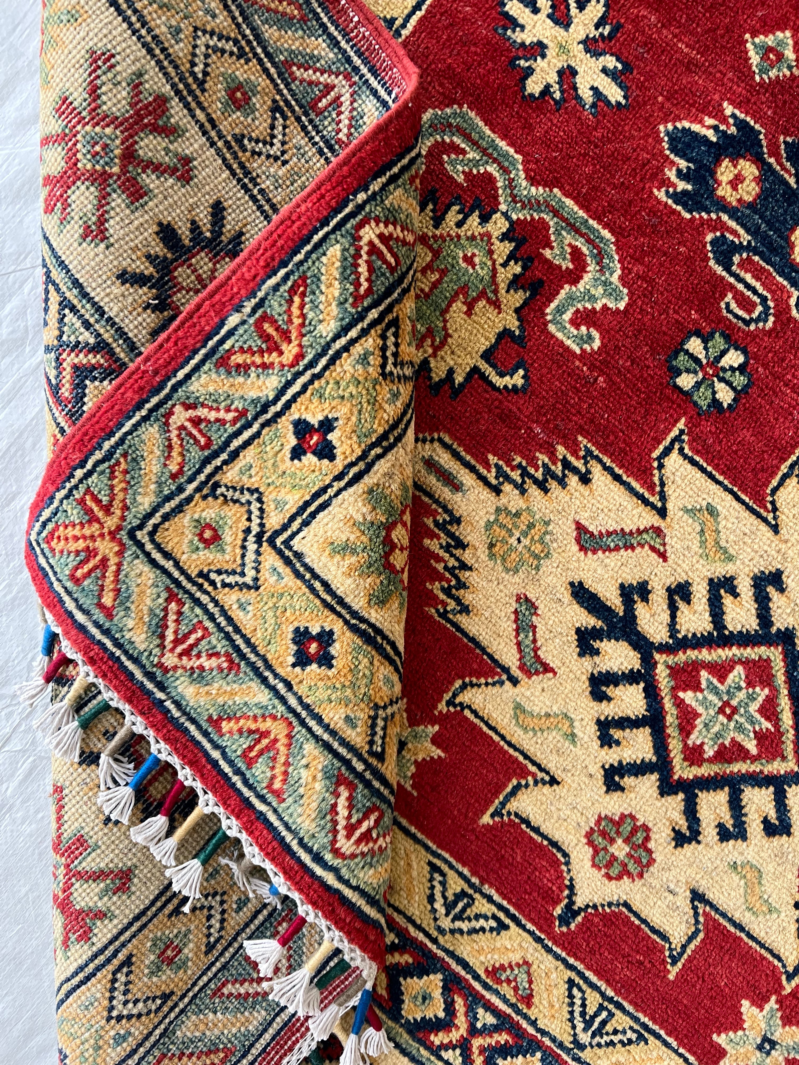 Afghani Rug 5x8 size range tribal Red Cream laid flat