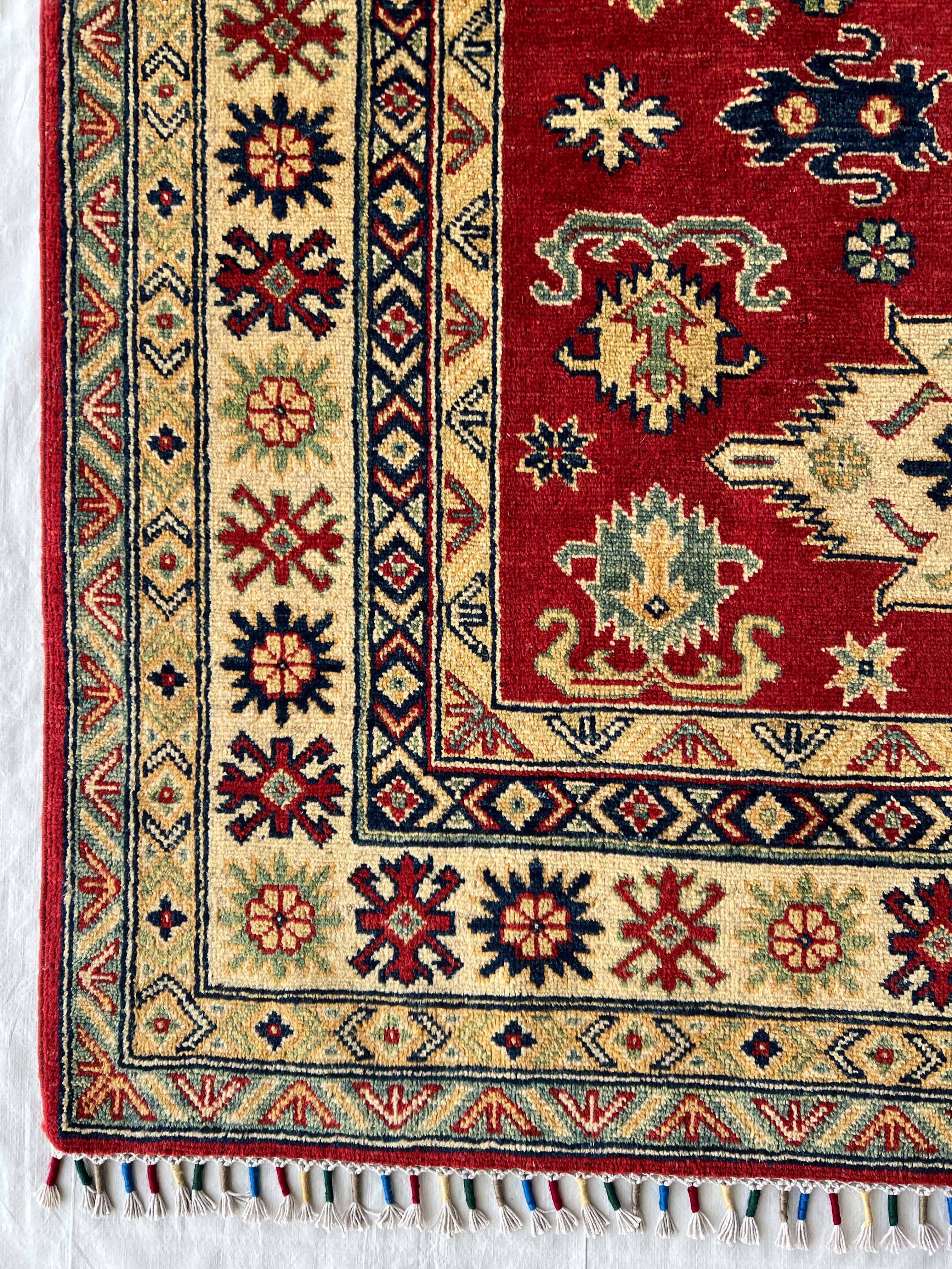 Afghani Rug 5x8 size range tribal Red Cream laid flat