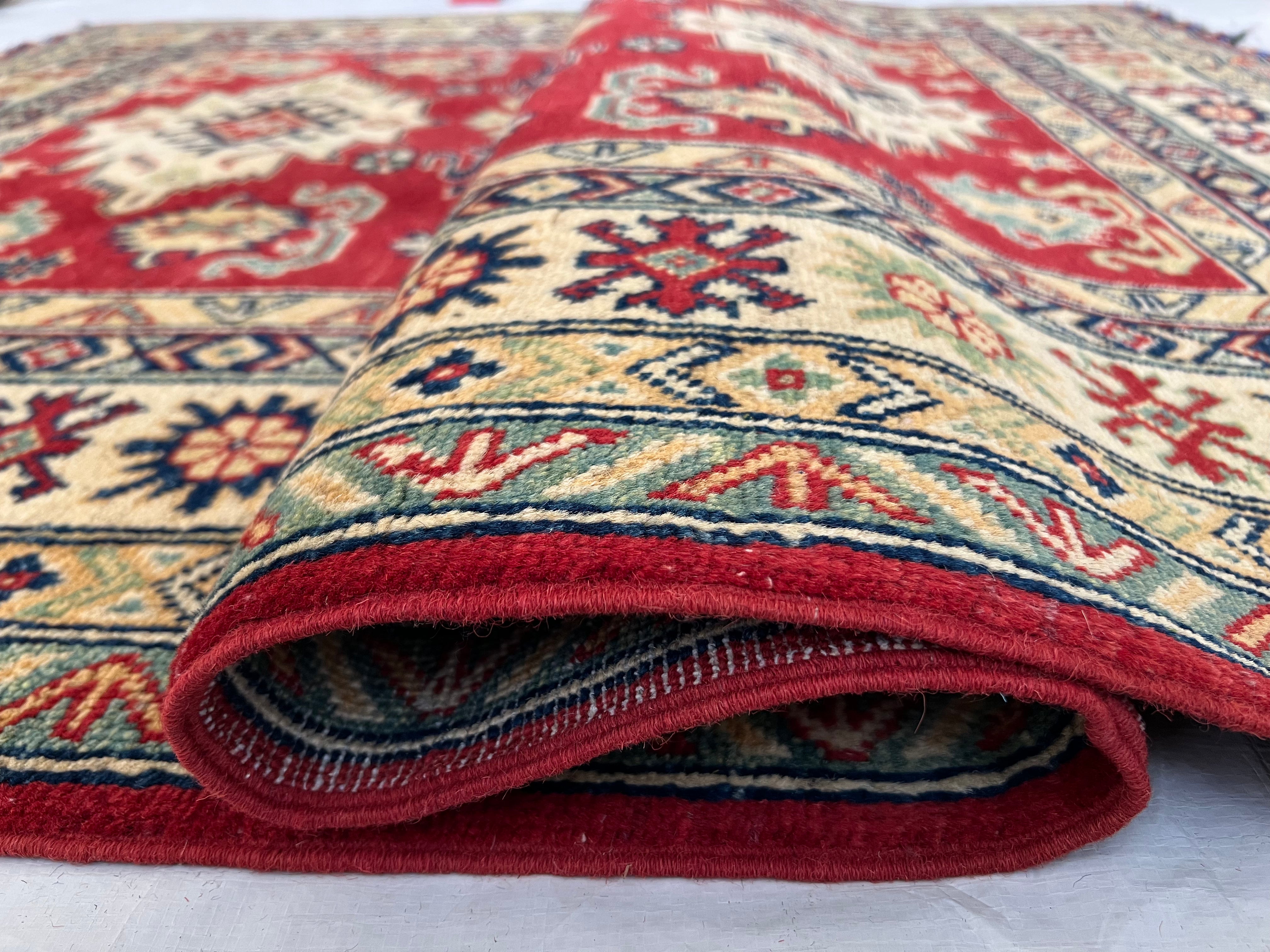 Afghani Rug 5x8 size range tribal Red Cream laid flat