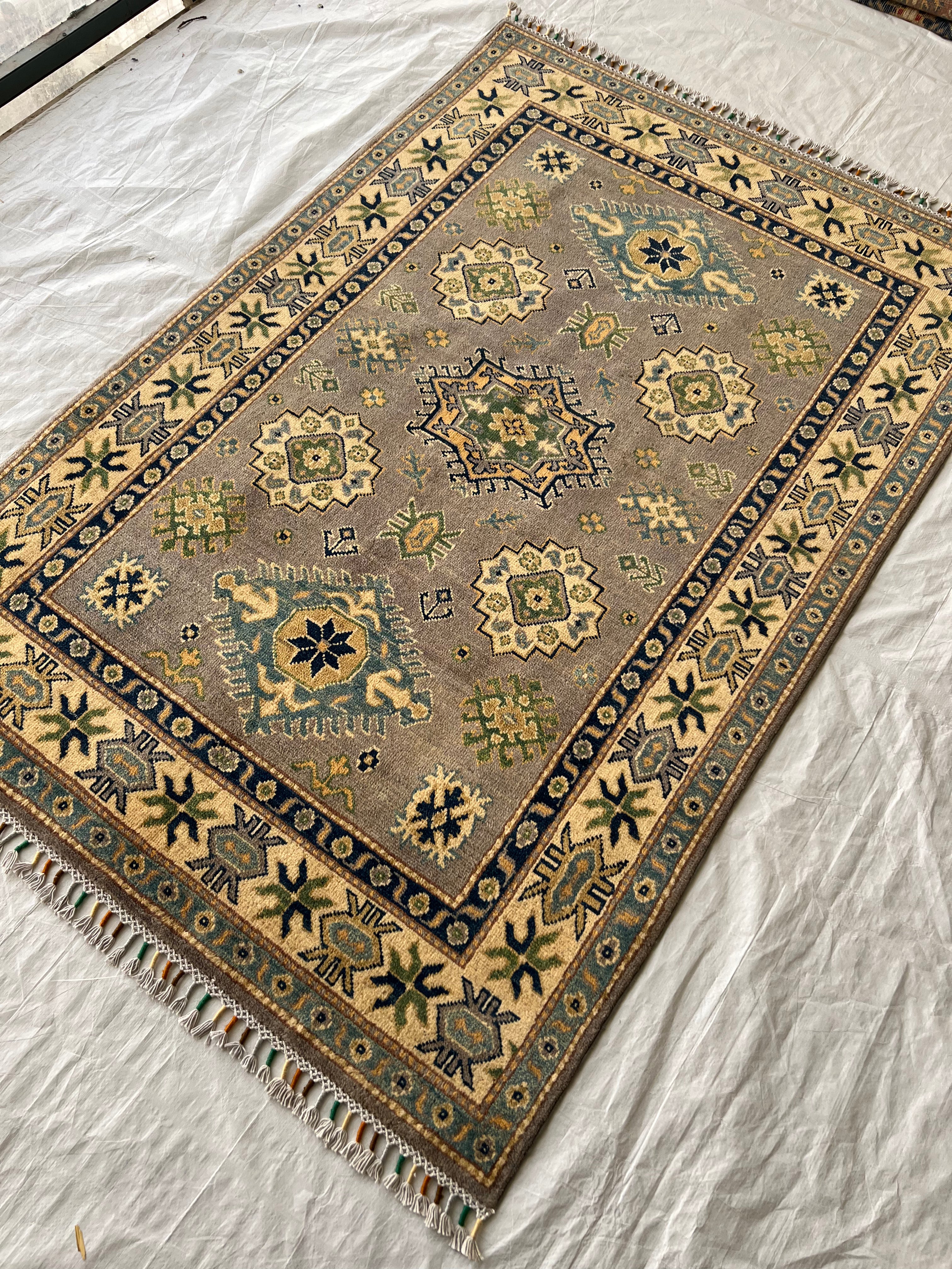 Afghani Rug 4x6 size range tribal Beige laid flat
