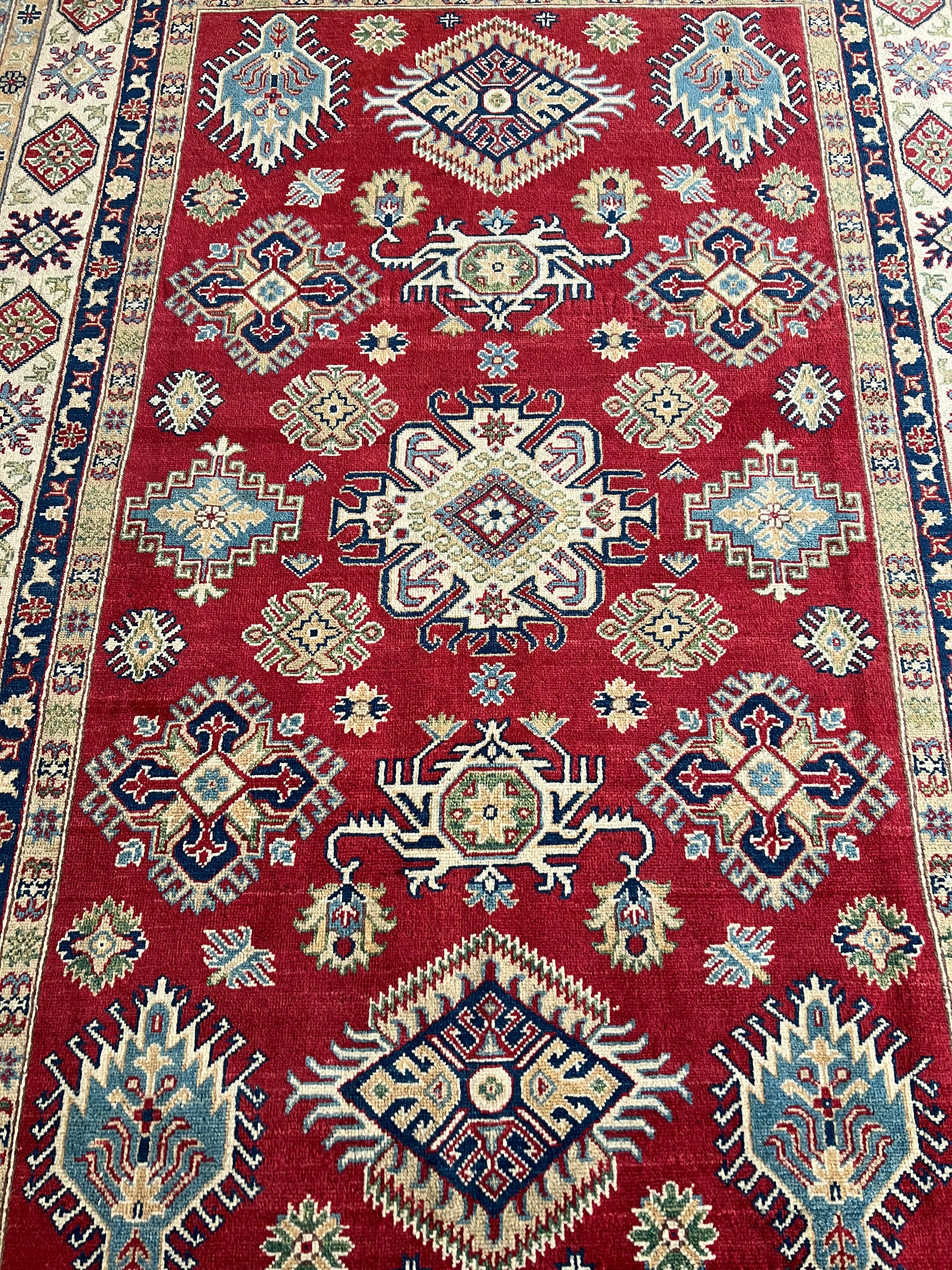 Afghani Rug 6x9 size range tribal Red Cream laid flat
