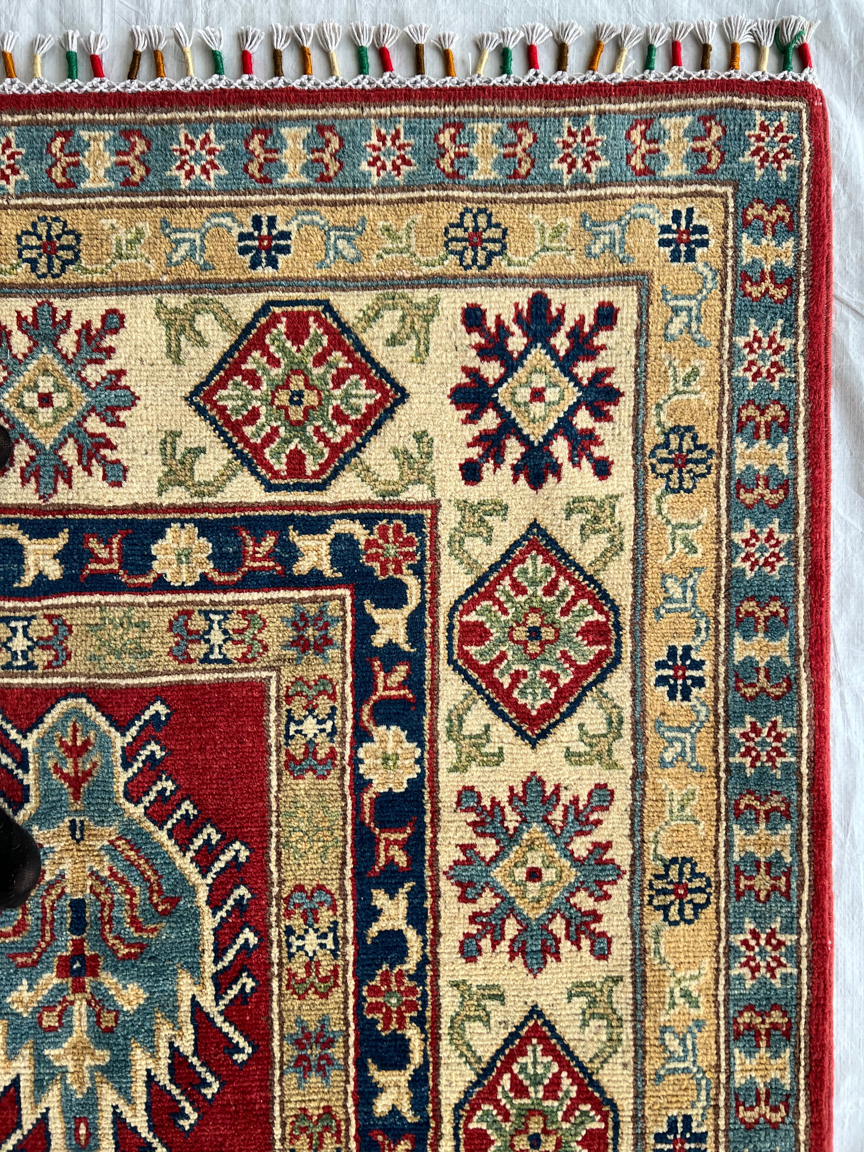 Afghani Rug 6x9 size range tribal Red Cream laid flat