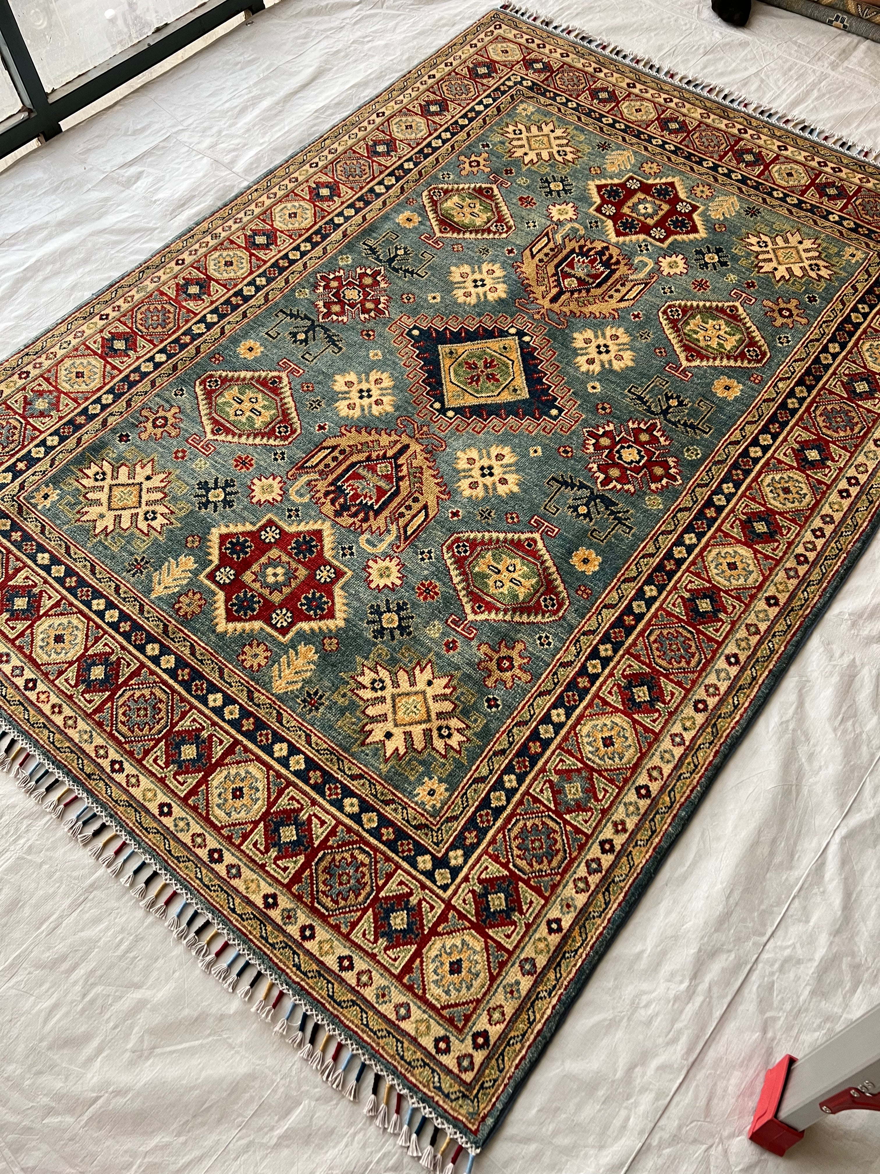 Afghani Rug 5x8 size range tribal laid flat